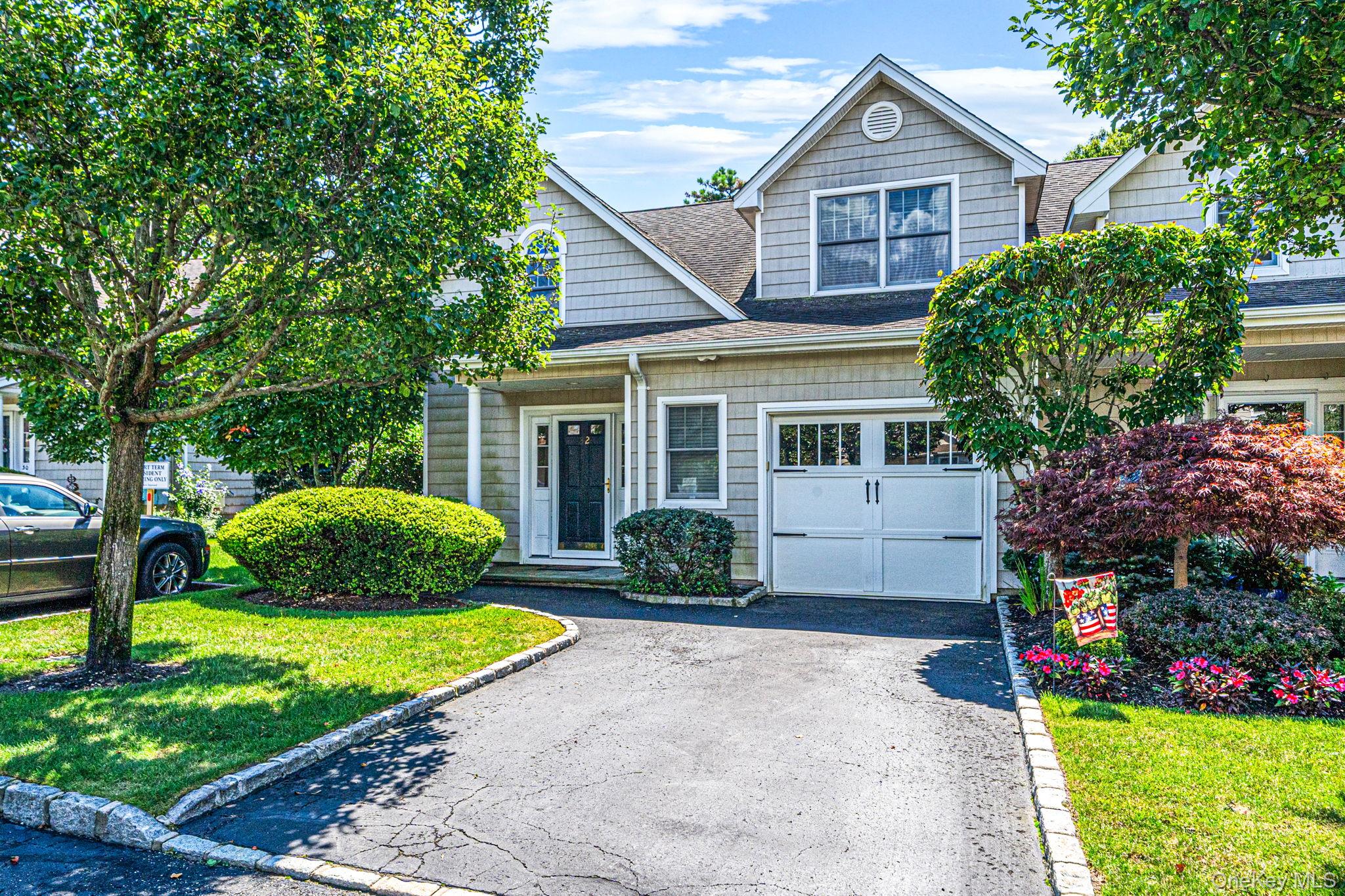 Highly Desirable Pinewood Gardens of Sayville! 55+ Community! Rare Diamond End Unit! Truly Move-In Condition with Top of the Line finishes throughout. An Entertainer's delight! Features a spacious, Open LR/DR layout with a cozy Gas fireplace. Sliding glass door opens to a premium Paver patio complete with a Rollout Awning and dedicated Gas hookup for your BBQ! Luxurious Master Suite on the First Floor with a beautiful Bathroom, plus a convenient First-Floor Laundry closet. The Second Floor boasts a beautiful, expansive Great Room space and a private Second Bedroom Suite with a Full bath, offering exceptional privacy for guests! Other high-end amenities include Radiant Heat throughout the First floor and in the Second-Floor Bath, an Alarm system, a 200 Amp electrical panel, a brand-new High-End efficiency Boiler, and an Attached Garage equipped with hot and cold water spigots. Currently the only available unit in this beautiful, highly sought-after Community! Turnkey opportunity available immediately at closing!