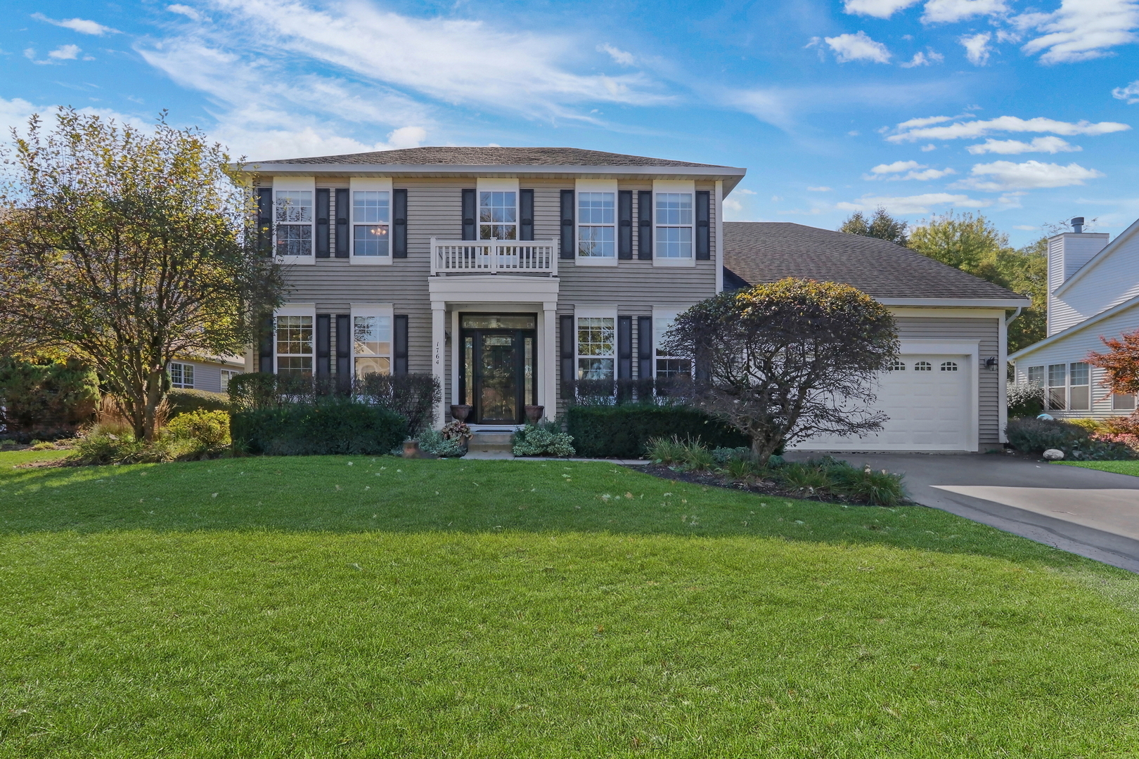 WELCOME HOME TO THIS STUNNING 5-BEDROOM HOME IN THE HIGHLY SOUGHT-AFTER COMMUNITY OF NATURES RIDGE! Offering an exceptional blend of space, style, comfort, and functionality, this gorgeous 2.5-bath home has everything you have been searching for and more. From its impressive volume ceilings and beautiful hardwood flooring to its spacious living areas and serene backyard retreat, every detail invites you to settle in and make yourself at home. Step inside and be greeted by a beautiful foyer highlighted by soaring volume ceilings, creating an impressive first impression and a bright, open feel. The formal living room offers an inviting space to entertain guests, host gatherings, or simply unwind, while the adjacent formal dining room sets the stage for memorable dinner parties, holiday celebrations, and special occasions with family and friends. Beautiful hardwood floors flow throughout portions of the main level, adding warmth, character, and timeless appeal. Prepare to fall in love with the spacious kitchen, truly the heart of the home! Featuring an abundance of cabinetry, generous counter space, a spacious center island, stainless steel appliances, and a double oven, this kitchen is designed to accommodate everything from busy weekday mornings to elaborate meals and weekend entertaining. A convenient eating area overlooks the backyard, allowing you to enjoy peaceful outdoor views while sipping your morning coffee or gathering for casual family meals. Just imagine hosting summer barbecues, celebrating special occasions, or enjoying quiet evenings in your own private outdoor retreat. The expansive backyard is sure to impress, featuring a lovely brick paver patio that provides the perfect setting for outdoor dining, entertaining, or simply relaxing and enjoying the fresh air. Mature trees create a beautiful natural backdrop while providing a wonderful sense of privacy, making this outdoor space a true extension of the home. Back inside, the main level continues to deliver with a dedicated office that is ideal for working from home, managing daily tasks, or creating your own hobby or creative space. A spacious mudroom offers valuable everyday functionality, providing a convenient drop zone for shoes, coats, backpacks, and all the essentials of a busy household. A half bath completes the main level, adding convenience for both residents and guests. Head upstairs, where you will discover a fantastic primary suite designed to be your own private sanctuary. The spacious bedroom offers plenty of room to unwind and recharge, while the private en-suite bathroom provides the perfect place to begin or end your day. Enjoy the convenience of a double-sink vanity, a relaxing soaking tub, a separate shower, and a walk-in closet offering excellent storage for your wardrobe and accessories. Three additional generously sized bedrooms provide comfortable accommodations for family members and guests, with plenty of flexibility to create additional workspaces, playrooms, or personal retreats. A full hall bathroom conveniently serves the additional bedrooms and completes the upper level. Need even more space? The basement delivers! Featuring a spacious fifth bedroom, this versatile lower level offers fantastic flexibility for overnight guests, extended family, or additional private living space. A dedicated laundry room and abundant storage space provide the practical features every household appreciates, keeping everyday essentials organized and tucked away. Whether you are looking for room to grow, space to entertain, a dedicated home office, or a peaceful place to unwind, this beautiful Natures Ridge home checks all the boxes. With five bedrooms, inviting living spaces, a well-appointed kitchen, a private backyard retreat, and room for everyone to spread out, this is an incredible opportunity to enjoy the space, comfort, and lifestyle you have been dreaming of. THIS IS THE ONE YOU HAVE BEEN WAITING FOR - WELCOME HOME!