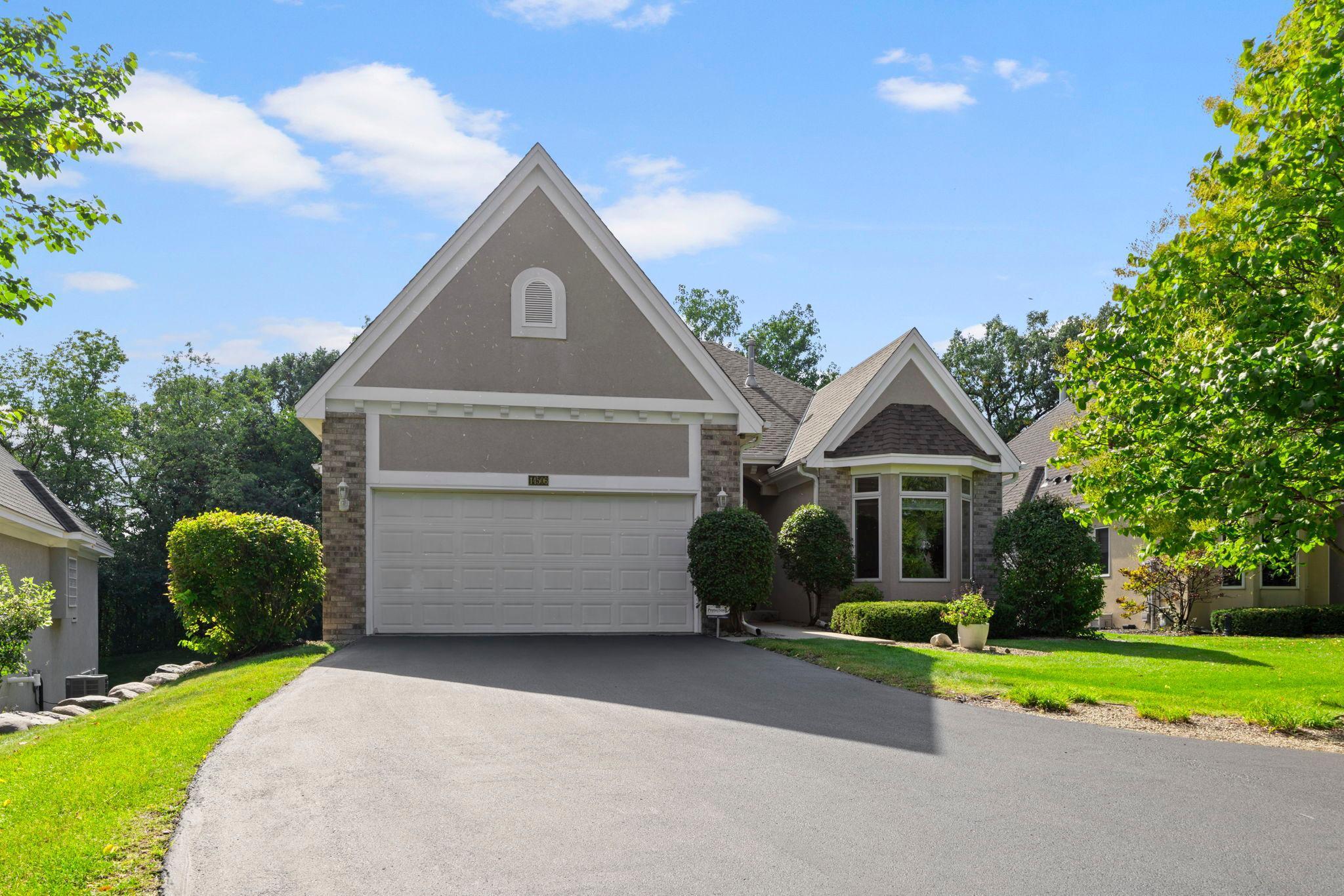 Bright, stylish, and designed for comfort, this 4-bedroom, 3-bathroom detached townhome combines everyday convenience with a peaceful, private setting. Tucked away in a quiet cul-de-sac, it provides the best of both worlds: easy access to shopping, dining, and commuting routes, along with a serene setting embraced by greenery, lakes, and parks.Step inside and be wowed by 11-foot ceilings, crown molding, and elegant pillars that frame the great room. A cozy gas fireplace and built-in entertainment niche create the perfect gathering space in the living room, while the sunroom invites you to relax with backyard views in every season. The kitchen is both functional and stylish, with stainless steel appliances, a peninsula, and sunny bay-window dining nook, plus a formal dining room with nearby buffet counter for organization and decor. The primary suite feels like a retreat with dual walk-in closets and a remodeled full bath featuring a soaking tub and walk-in tiled shower. A second bedroom, ¾ bath, and convenient laundry/mudroom round out the main level.The lower level is made for entertaining, offering a spacious family room with fireplace, wet bar, and plenty of room for games or movie nights. Two more bedrooms, a full bath, and generous storage ensure everyone has space.Outside, enjoy a private backyard oasis with a maintenance-free deck and large paver patio—ideal for morning coffee, summer grilling, or evenings under the stars. Recent updates including a new roof, newer mechanicals, and fresh finishes add peace of mind, while the HOA takes care of lawn, snow, and exterior maintenance—leaving you free to simply enjoy.