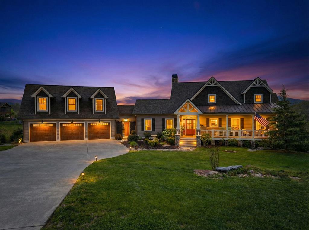 Custom Craftsman Mountain Oasis 3 bed | 3.5 bath | 3-bay garage | 3.81 private acres at the end of a cul-de-sac Perched with sweeping long-range mountain views to the south across a grassy yard and gentle stream, this custom home feels worlds away yet sits in a sought-after upscale neighborhood. Thoughtful and extensive custom hardscaping and softscaping with over 60 trees and shrubs create a true mountain retreat with unmatched privacy and serenity. Inside, the upgrades are endless: newly refinished solid white oak floors, a stacked-stone wood-burning fireplace with gas starter, solid-surface countertops, and nearly new high-end appliances. The open living area features oversized windows and doors that open to a spacious screened porch and grilling deck—perfect for effortless indoor-outdoor living. The primary suite is on the main level, with two additional bedrooms (each with private full baths) on the upper and lower levels, plus a powder room. A conditioned office/creative studio sits above the garage. Recent updates including fresh paint inside and out, a brand-new roof, professionally cleaned air ducts, and new loft carpet make this 2016-built home feel brand new. Enjoy multiple outdoor entertaining spaces with breathtaking views, a fully fenced pet yard, and a custom firepit ideal for stargazing under the Milky Way thanks to minimal light pollution. Just 2 hours from Atlanta, Greenville, Chattanooga, and Asheville, you're minutes from Lake Chatuge, hiking trails, local wineries, restaurants, coffee shops, and the John Campbell Folk School—yet enjoy the peace of a low-key rural lifestyle. Too many luxury details to list here—see them all in the professional photos and video. Schedule your private tour today and experience this rare mountain gem in person! Also available separately is the adjoining 1.15-acre Lot 21 with matching mountain views.