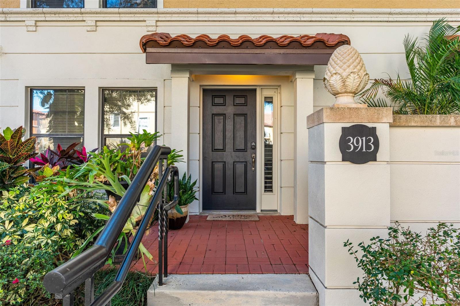 MOVE-IN READY 4-STORY LUXURY TOWNHOME WITH ELEVATOR IN FOUNTAIN PARKE. Well-positioned in today’s market, this beautifully updated residence in one of Lake Mary’s most desirable guard-gated communities offers 4 bedrooms, 4.5 bathrooms, and a flexible layout designed for easy living and low maintenance. A private first-floor bedroom with its own ensuite provides a comfortable space for guests or extended stays, while the main living level features an open layout filled with natural light, bamboo flooring, a convenient laundry room, and a half bath. The kitchen is equipped with stainless steel appliances including a new microwave and newer refrigerator and offers a center island and separate coffee/bar area for everyday use or casual entertaining. Upstairs, the primary retreat offers dual closets and a spacious bath with separate sinks, a walk-in shower, and a soaking garden tub. A nearby guest room, currently used as an office, opens to a private balcony and has access to a full hall bath. The upper level creates a true retreat, featuring a newly enclosed suite with a full bath and built-in closet that can function as a fourth bedroom or a second living area; this space opens directly to two rooftop patios, offering a quiet place to relax, entertain, or enjoy outdoor living without the maintenance of a single-family home. Fresh interior paint throughout and improved HVAC efficiency and airflow from the enclosed top floor enhance everyday comfort. Elevator access to all levels makes daily living simple and convenient. Fountain Parke residents enjoy 24-hour guard-gated security and resort-style amenities including a pool, fitness center, clubhouse, tennis, pickleball, and playground, along with easy access to I-4, FL-417, dining, and shopping.