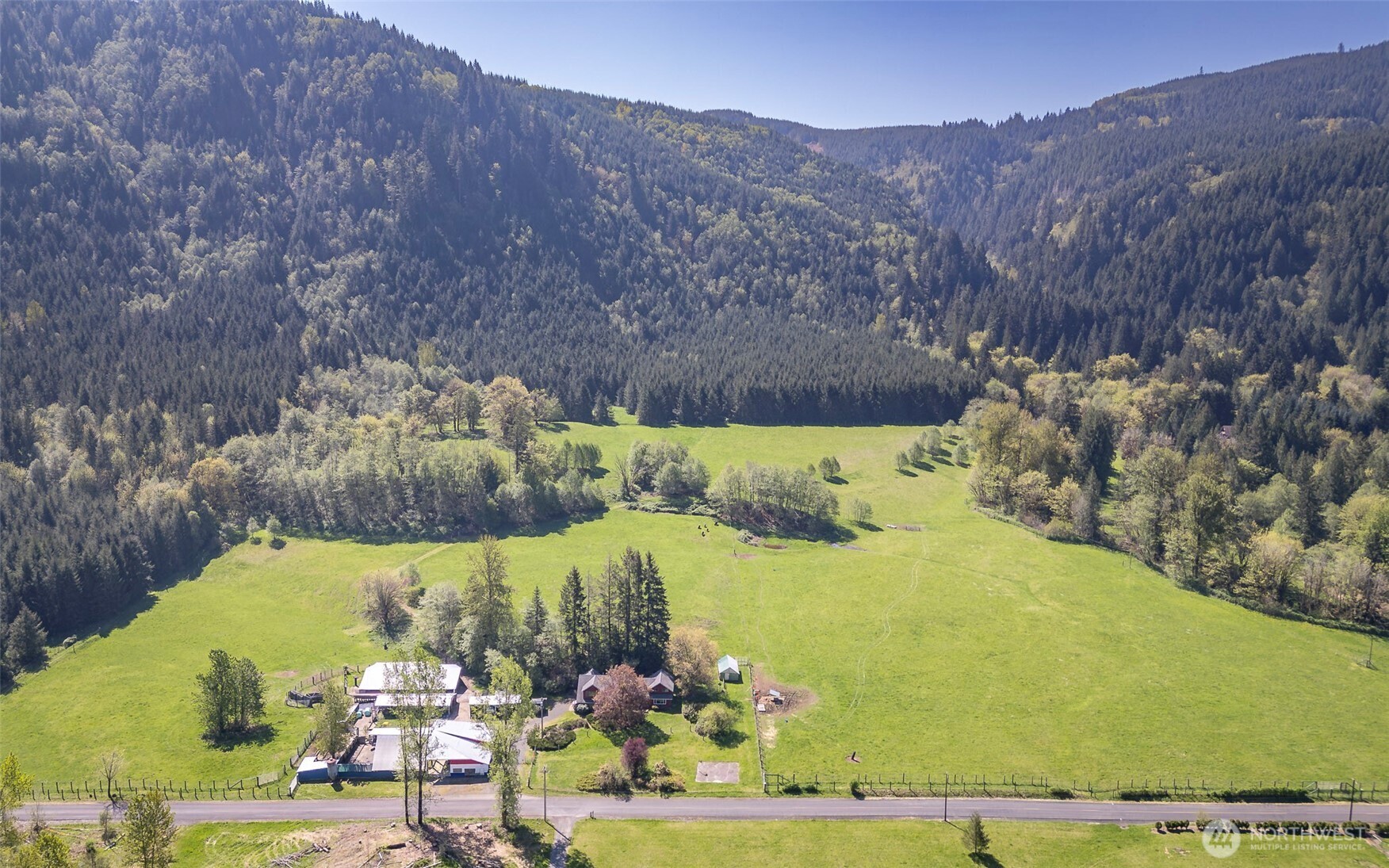 Escape to your own 40-acre paradise in Bremer Valley! Imagine having easy freeway access while enjoying complete privacy on this amazing property. Picture yourself waking up to breathtaking mountain views, the soothing sounds of Hansard Creek running year-round, and the sight of endless mountains, bordered by state forest land, and wildlife – it's a truly idyllic and peaceful setting. The well-kept pastures and nearby State Forest trails add to the charm. The heart of this estate is a gorgeous farmhouse with over 2,800 sq ft, featuring 5 bedrooms, 2.5 baths, and ample storage. You'll love the modern kitchen appliances and the durable 50-year roof. Plus, there are multiple outbuildings perfect for a hobby farm, raising animals, or gardening. With two wells, one near the house and another on a secluded hillside for future possibilities, this property has it all. Just minutes from Morton and the hospital, and a quick 30-minute drive from I-5, you'll have the perfect blend of natural beauty and convenience. Get in touch for a complete list of all the wonderful features!