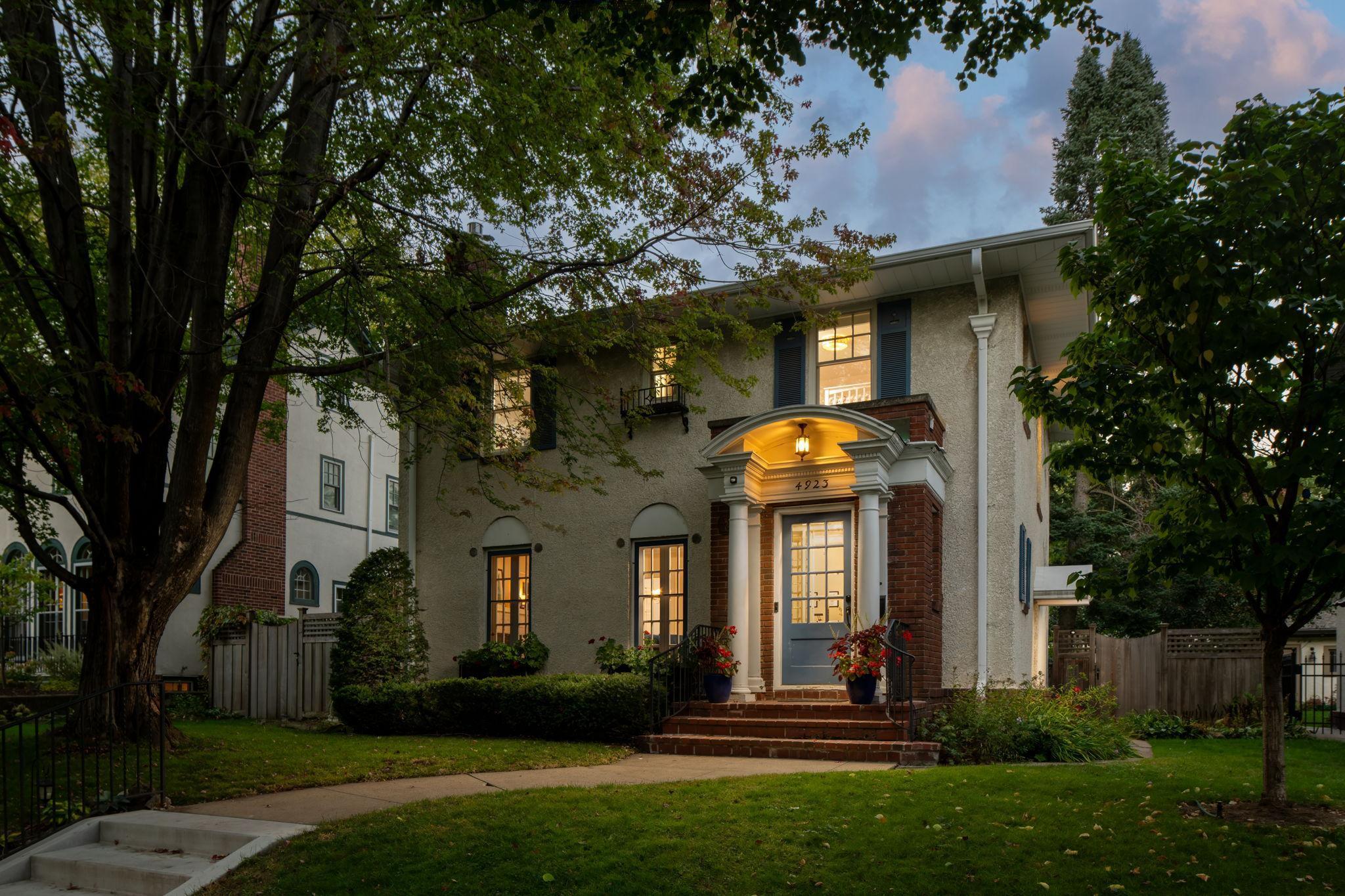 Stately and timeless, this stucco and brick two-story rests on a premier lot just steps from Lake Harriet in the heart of highly sought-after Fulton. Brimming with vintage charm, the home showcases rich architectural details throughout. Generous living spaces provide both comfort and character, while the lush, private and fully fenced backyard offers an idyllic retreat—perfect for relaxing or entertaining. Large, open and updated basement with ample room for activities. A rare opportunity to enjoy historic beauty and an unbeatable location near the lake, parks, and vibrant neighborhood amenities.