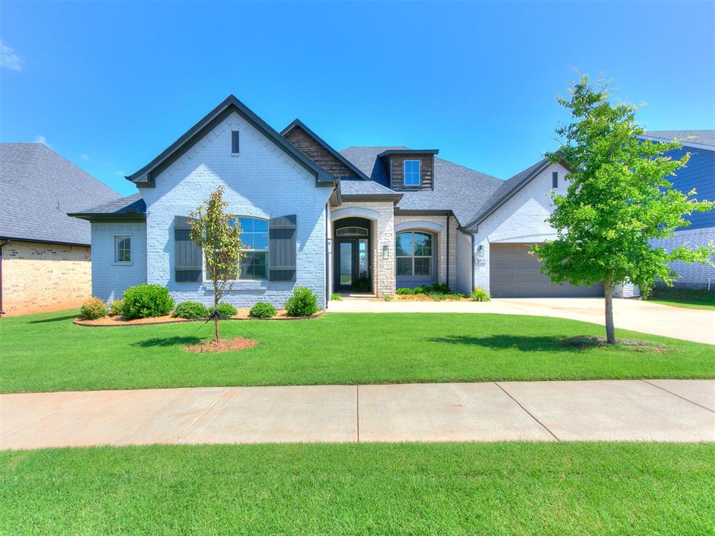 Beautifully located in north central Norman, this light-filled home features an open-concept layout with floor-to-ceiling windows, spacious living and dining areas, and a well-equipped kitchen with ample storage and a large corner pantry. A versatile office with hardwood floors and a paneled ceiling can double as a playroom or gym. Enjoy serene views of a pond, walking trail, and open fields from the main living spaces. The primary suite offers private backyard access and a large walk-in closet. Includes a 2-car and separate 1-car garage, both with attic storage, plus an in-ground storm shelter. Just minutes from I-35 and shopping. Located in Little River Trails, a neighborhood with wooded trails, 2 ponds, a park, a pool, and a clubhouse with a fitness center.