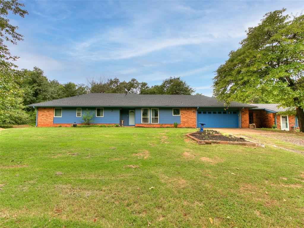 TWO HOUSES UNDER ONE ROOF. 
   A NEW ROOF was installed in 05/2025. This property is situated on 1.58 private, wooded acres in the TOP-RATED EDMOND SCHOOL DISTRICT. Just minutes from I-35, it is located directly across from the Landing development on Waterloo, with new restaurants and shops coming soon. 
   This property includes a 3-bedroom, 2-bath MAIN HOME (1,668 sq ft) featuring a spacious living room with fireplace and built-in bookshelves, a large kitchen and dining area with updated tile flooring (2020), a primary suite with two closets and a renovated shower (2022), built-in hallway storage, laundry with pantry shelving, and an attached 2-car garage. 
   Recent updates include a tankless water heater, water softener, and oven (2020), new well pump (2022), new tile in the living room and hallway (2024), fresh paint and hardware on cabinets and trim (2022), and new back doors (2022). 
   The separate APARTMENT (797 sq ft, built in 2021), 2 bedrooms and 1 bath, offers tile flooring throughout, custom cabinets, quartz countertops, thermopane windows, a minisplit HVAC system, and includes a new fridge and oven. Perfect for rental income, Airbnb or extended family visits. 
   The property also has a private well and septic system, plus a shed for the lawn mower. The oversized 2-car garage provides extra storage space. This versatile and beautifully maintained property offers both privacy and potential—schedule your showing today!