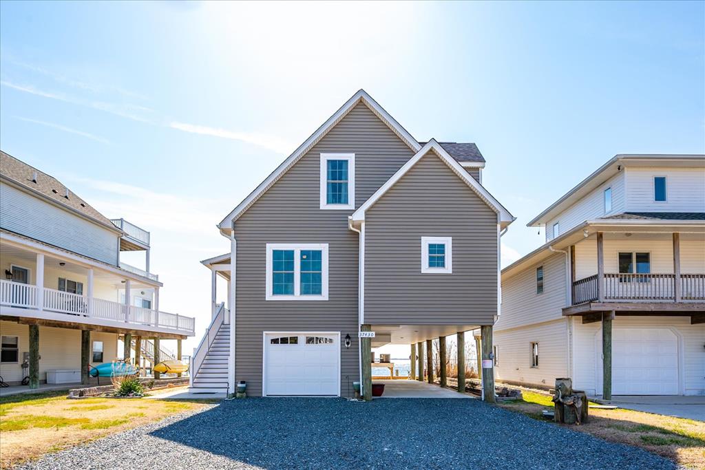 Stunning Bayfront Living with Breathtaking Views of Chincoteague Bay.  Welcome to this exceptional 3-bedroom, 3-bathroom home offering 2076 square feet of luxurious living space and unparalleled views of the Chincoteague Bay. Step inside to discover a thoughtfully designed interior with 9-foot ceilings, a gas fireplace, and high-end finishes throughout, gourmet kitchen boasting stunning granite countertops and a gas stove.  The first-floor master suite offers ultimate privacy and convenience, complete with a spacious layout, ceramic tile bathroom and walk-in closet.  Additional highlights include an elevator for easy access to the first level, a newly constructed bulkhead and outdoor shower. Don't miss the opportunity to own this exceptional waterfront property! Schedule your tour today!