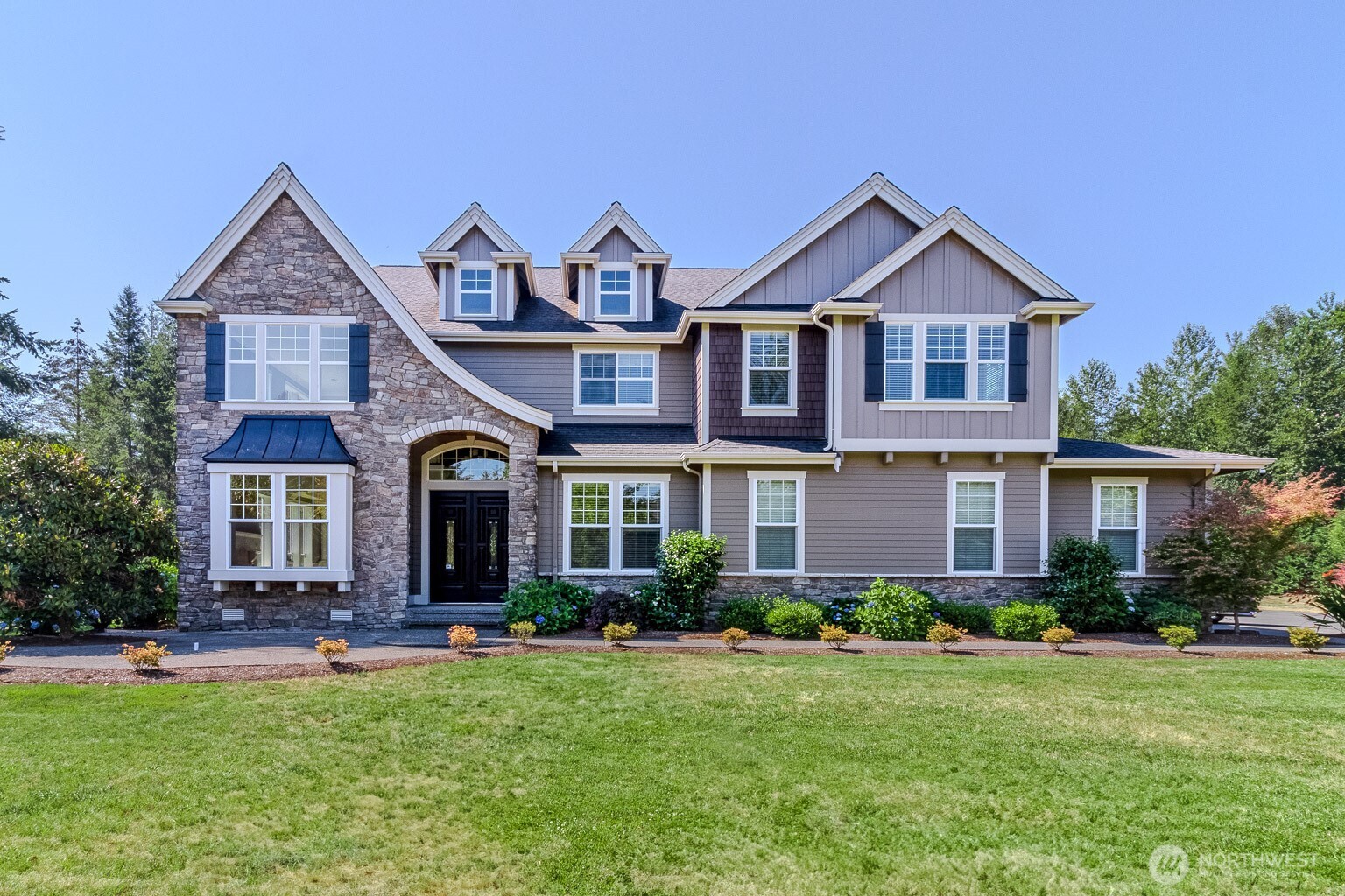 Welcome to The Reserve at Lake Sawyer! Positioned on an expansive, flat corner lot, this beautifully maintained home offers an exceptional blend of comfort, functionality, and endless potential. The impressive outdoor space invites endless possibilities—envision a pool, sport court, ADU, garden retreat, or custom entertaining area tailored to your lifestyle. Inside, a bright, open great room flows seamlessly into the dining area, creating an inviting setting for both everyday living and entertaining. The kitchen features an eating area and connects easily to the cozy living room with a gas fireplace, while a main-level office provides flexibility for remote work, creative pursuits, or additional living needs. Large windows fill the home with natural light, and A/C ensures year-round comfort. Upstairs, the spacious primary suite offers a peaceful retreat with its own gas fireplace, dual closets, and a well-appointed 5-piece bath. Three additional bedrooms and a generous bonus room provide versatile options for a variety of living arrangements. Completing the home is an impressive 1,400 sq ft 4-car garage, offering exceptional space for vehicles, storage, hobbies, or projects. With thoughtful design, flexible spaces, and extraordinary outdoor potential, this home is a standout opportunity in desirable Black Diamond.