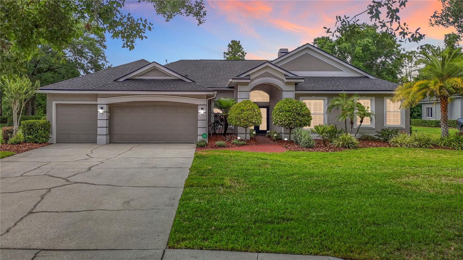 Discover luxury living in this stunning single-story pool home at 19128 Centre Rose Blvd in the prestigious gated Faberge Enclave of the VillaRosa community in Lutz, FL 33558.This exceptional 2,907 sq ft residence boasts 4 bedrooms, 3 full bathrooms, a dedicated office, and an attached 3-car garage. The home is nestled on nearly a half-acre private wooded conservation lot, offering tranquility and seclusion while featuring soaring 11-foot ceilings, an open floor plan flooded with natural light. Expansive sliding glass doors span nearly the entire rear of the home—including pocketing sliders in the family room—creating a seamless transition between indoor and outdoor living. The pocketing sliders and expansive picture window are appointed with custom remote-controlled light-filtering shades. The split floor plan provides privacy with generously sized bedrooms, and a separate guest room and bathroom are tucked discreetly to the rear of the home.Extensive updates elevate this home to turnkey perfection: a brand-new roof (2025), new pool motor and garage door motor with app access (2025), updated alarm system with transferable 24-hour professional monitoring, a 2024 pool heater and multi-colored LED pool light, a 2023 saltwater system, and a striking 42-inch contemporary fireplace serves as a dramatic focal point, featuring a sleek floor-to-ceiling surround inspired by the elegant appearance of natural quartzite. The exterior showcases a fresh modern palette of soft earthy neutrals for timeless appeal. Additional highlights include a 2016-upgraded saltwater pool with deep blue pebble sheen, travertine deck, enlarged lanai, black aluminum cage, and an outdoor stainless-steel kitchen with granite counters. The chef’s kitchen shines with custom cabinets, quartz countertops, and GE Café Series smart stainless-steel appliances. Additional enhancements throughout the home include, engineered hardwood and porcelain tile flooring, a remodeled master bath with travertine and marble finishes with an oversized shower, soaker tub, custom closet systems, plantation shutters, whole-house water filtration/softener, reverse osmosis, professional landscaping with palms and lighting, and a hardwired 9-camera surveillance system complete the picture of refined Florida living.VillaRosa offers an outstanding lifestyle with no CDD fees. Residents enjoy two community parks featuring tennis and pickleball courts, basketball courts, playgrounds, athletic fields, covered picnic areas, green spaces, and scenic walking trails with lake views, and just a short walk or bike ride to the Sun Coast Bike Trail—perfect for families and active lifestyles alike. The property is zoned for highly rated A schools, including McKitrick Elementary, Martinez Middle, and Steinbrenner High School.Ideally located- to world-class attractions: Busch Gardens Tampa Bay for thrilling entertainment, Tampa Premium Outlets and abundant shopping/dining, Lettuce Lake Park and Brooker Creek Preserve for nature trails and wildlife viewing, plus quick drives to Tampa International Airport, downtown Tampa, Clearwater Beach, and more Gulf Coast destinations. This prime Lutz location combines peaceful suburban charm with convenient urban access.This meticulously maintained home represents a rare opportunity in one of Lutz’s most desirable gated enclaves!