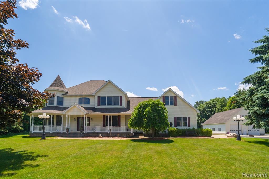 Exquisite Custom-Built Estate on Rolling Acreage in Imlay City! Experience refined country living in this stunning 3 bedroom, 3.5 bath custom-built home, gracefully situated on a serene expanse of private, rolling land just minutes from the heart of Imlay City. Thoughtfully designed with timeless craftsmanship and modern comforts, this residence offers a harmonious blend of luxury, space & natural beauty. Step inside to discover a light-filled layout featuring soaring ceilings, rich oak trim & floor to ceiling windows that frame picturesque views of the gently rolling terrain beyond. The open-concept living area flows effortlessly into a gourmet kitchen adorned with custom cabinetry - ideal for both everyday living & entertaining. The primary suite is a peaceful retreat, complete with a spa-inspired ensuite bath & tranquil views of the wooded landscape. Two additional bedrooms plus a large bonus room that could be a 4th bedroom provide ample space for family & guests while 3.5 baths ensure comfort & convenience for all. The finished walkout basement with a lovely patio offers many possibilities - whether as a stylish entertaining space, home theater, gym, or multi-generational living quarters. Outdoors enjoy ultimate privacy and a front-row seat to nature's beauty. The expansive grounds, complete with mature trees & wide-open vistas, are perfect for enjoying wild life, gardening or simply unwinding in the peace & quiet of your own private oasis. A 40 x 60 two-story pole barn with 14' ceilings, diamond coated floors & a bathroom offers even more space for a studio or hobby! New furnace in 2022, roof & siding in 2020 plus on-demand generator. Located with easy access to local shops, schools & commuter routes, this extraordinary property offers both seclusion & convenience. Additional acreage available if desired. A true gem for those seeking elegance, comfort & room to roam. Your dream lifestyle awaits - schedule your private showing today!