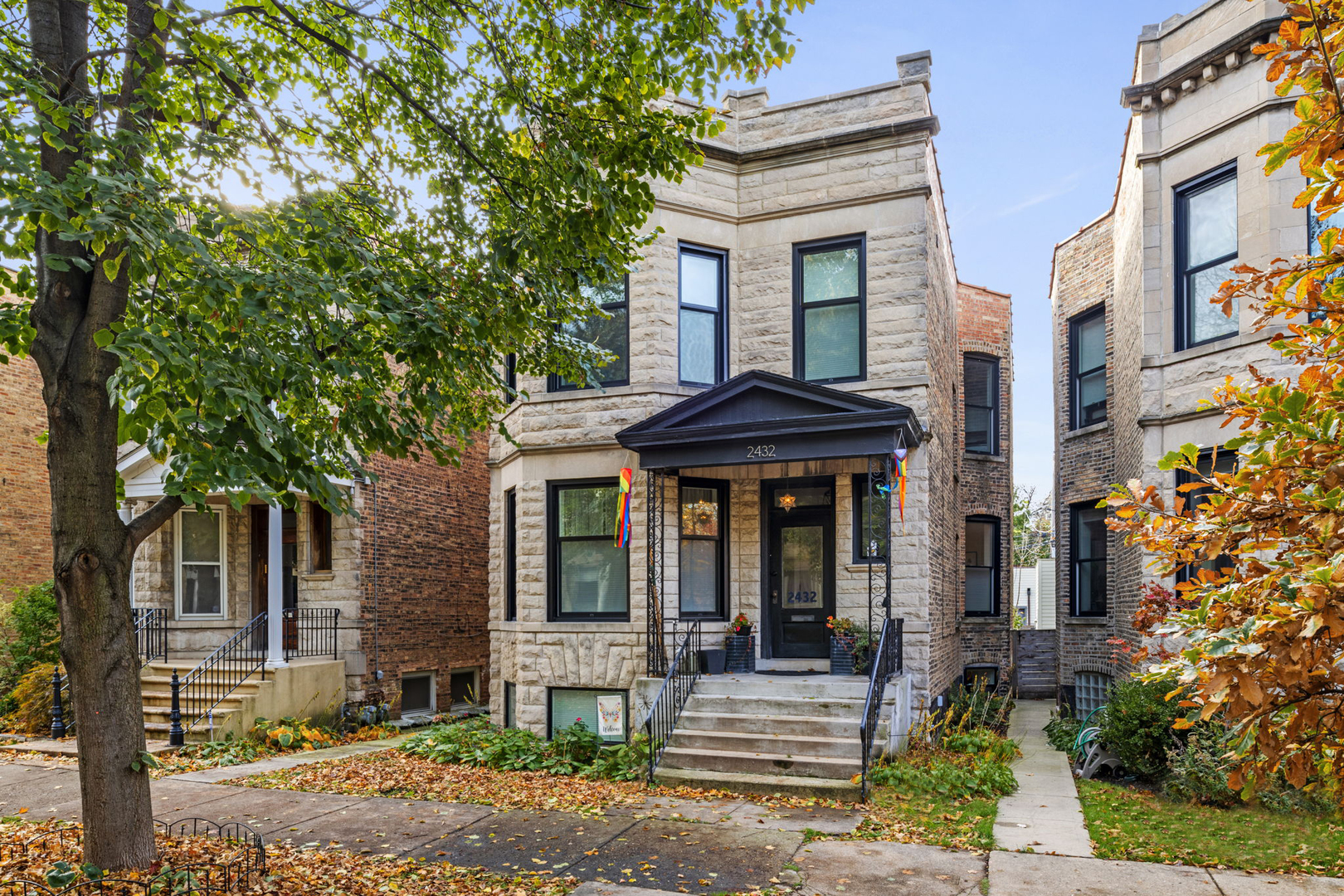 This historic 1898 Greystone home in Logan Square is a perfect blend of old and new. It has been carefully restored and updated with high-end features and finishes, while keeping its original charm and elegance. This stunning 5-bedroom, 4.5 bathroom home has been meticulously renovated from top to bottom, preserving its original character while adding modern amenities and luxury finishes. You'll love the spacious kitchen with a 10-foot quartz island, walk-in pantry, breakfast bar, chef's grade stainless steel appliances, custom tile, and exquisite carpentry.  The first floor is completely open concept: from foyer to enclosed porch or sunroom, with kitchen, sitting room, dining room, living room & powder room in between all with beautiful hardwood flooring. The 2nd floor master suite features a large walk-in closet, a home office, ensuite bathroom and a cozy sitting area with plenty of natural light from the west. Round out the second floor with 2 additional bedrooms, BOTH with ensuite bath, & full-sized walk-in laundry room round out the top floor. The lower level has been fully excavated to offer high ceilings, a recreation room, two additional bedrooms, and second another laundry area with hookups. Enjoy the beautiful landscaping and the convenience of a new 1.5 story 2+ car garage that has a loft the entire size of the garage footprint for extra storage. All new aluminum clad Pella windows, sprayed insulation throughout the entire home,  plumbing, electrical, foundation and masonry work, I-beam, framing, drywall, fixtures and more. Heated marble floors in bathrooms. New sidewalk and garage slab. This is a unique chance to own a historic home in one of Chicago's most sought-after neighborhoods. Don't let it pass you by!