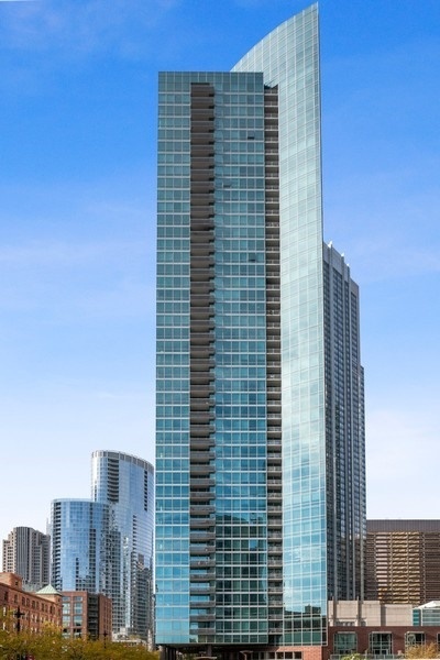 Don't miss this high floor 2BR/2BA corner unit, the largest floorplan with a wall of floor to ceiling windows!  The panoramic views of Lake Michigan, the Chicago River, Bennett Park and the city skyline, and abundant natural light pour in through expansive floor-to-ceiling windows. This thoughtfully designed split floor plan creates an ideal, open-concept living and entertaining space while also offering ultimate privacy for both bedrooms.  The living/dining space is expansive by city standards, and can easily accommodate an 8-top dining table. Enjoy a morning cup of joe while watching the sun rise from the private, east-facing balcony with lake views. In the primary suite, luxury and comfort were at the forefront of design, which perfectly fits a king size bed. Retreat to the ensuite primary bathroom with dual vanities, walk-in shower and separate whirlpool tub. The hall bathroom is conveniently adjacent to the second bedroom, creating a private ensuite-like experience for guests or family members. Working from home and having a guest room is possible in this second bedroom. An in-unit laundry makes life easy, as do the storage locker included in the price. Gas cooking and 4 pipe heating system. Indulge in the ParkView's full suite of amenities including a 24/7 door staff, outdoor pool & hot tub, fitness center, hospitality room and resident lounge. Deeded parking space #505 is available for 45,000 additional. This Streeterville location cannot be beat, as everything is right outside the door. Across the street from Target, several coffee shops like Cupitol, and plenty of restaurants like Robert's Pizza, D4, Pinstripes, Molly's Cupcakes, Carson's and Yolk all within one block. AMC Movie Theatre, Lucky Strike Bowling, Navy Pier, Ohio Street Beach & Park, Michigan Avenue/Mag Mile, are all within 2-3 blocks. ParkView has a dog run via the adjacent Bennett Park dog park with separate spaces for both large and small dogs.  A great condo in an excellent building and in the best neighborhood, Streeterville!