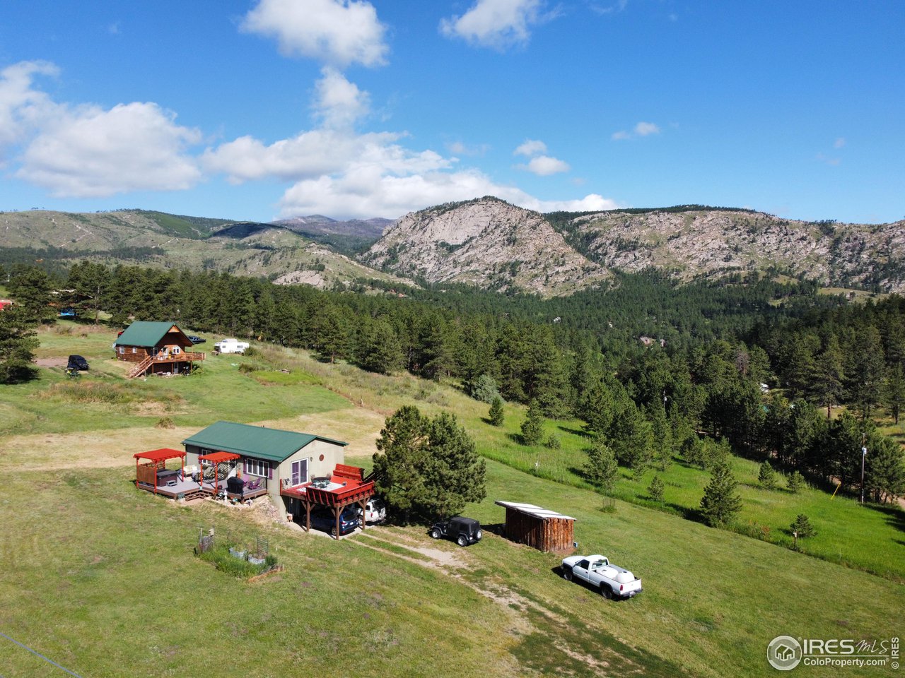 This home sits below Storm Mountain in the valley of Cedar Springs Estates. The perfect getaway, all encompassed by the Rocky Mountains. Furnished ranch style home offers vaulted T&G pine ceiling, 2 Bedrooms, 1 bath, plus office and a walkout basement. 2 expansive decks for enjoying the outdoors and a 2-car carport all on 1.62 acres. Make this dream come true with $9,000 BUYER CREDIT (buy down interest rate / closing costs).  Showings by appointment only - Security Cameras on property.