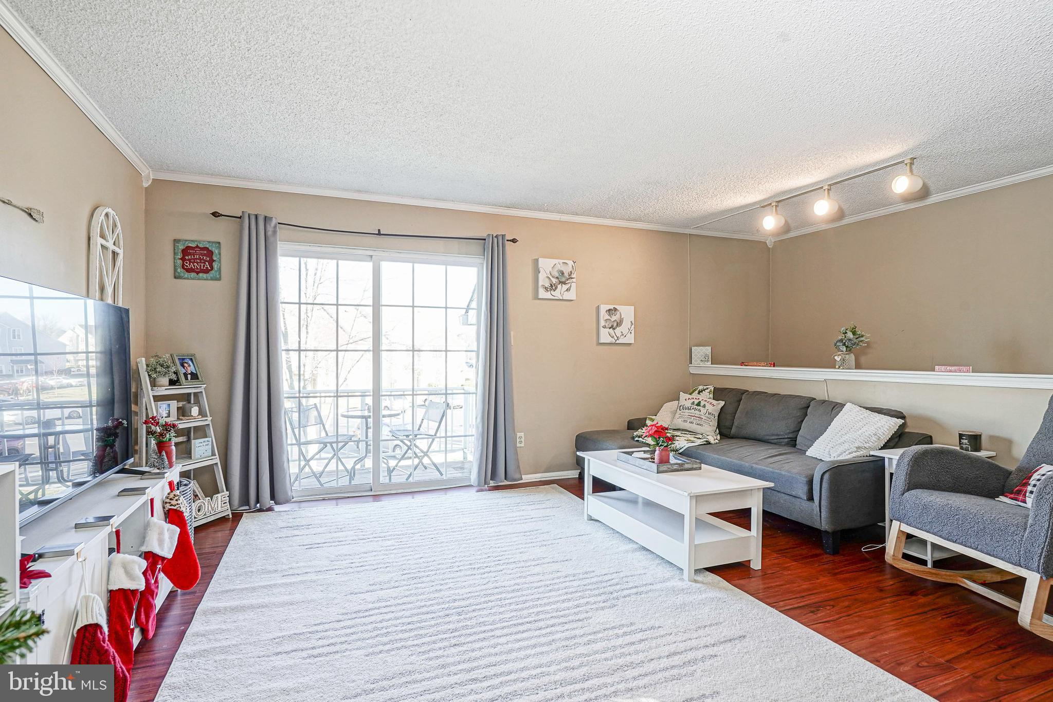 Amazing Opportunity To Own A Clean And Neutral 2 Bed,  1 Bath Second Floor Condo In An Ideal Location. Laurel Place Offers Plenty Of Recreation Options AND Is Walkable to Shopping , Dining, And Parks,  As Well As Being Perfectly Situated Minutes From Major Roadways, Schools, And More. Highlights Include An Open Floor Plan, Large Living Room With Sliding Glass Doors Allowing An Abundance Of Natural Light, Gleaming Luxury Vinyl Plank Floors, And A Charming Pass Through From The Kitchen To The Dining Room.  You'll Adore The Spacious Primary Bedroom With Walk In Closet, Full Bath Accessible From Both The Primary Bedroom And Hallway, Generously Sized Second Bedroom With Double Closet, And Balcony Where You Can Enjoy That Morning Cup Of Coffee. So Much To Offer! Don't Miss Your Chance To Start 2026 In This Fantastic Condo!