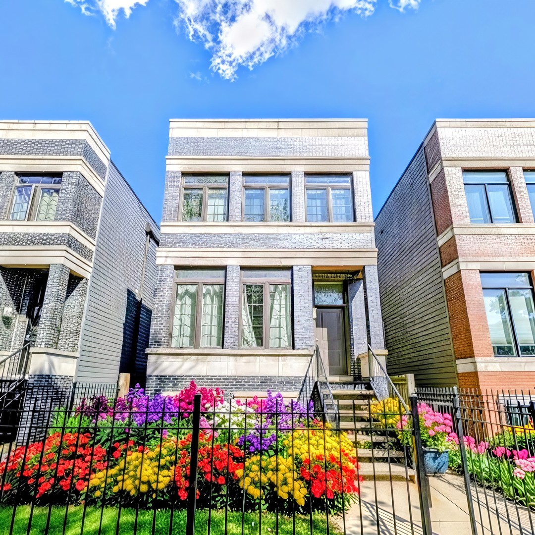 Newer-construction single-family home on a quiet, tree-lined block in Bronzeville. Thoughtfully designed 5BR/3.1BA layout with a bright, open main level-tall ceilings, wide-plank hardwoods, and a chef's kitchen featuring shaker cabinetry, quartz countertops, island seating, and stainless appliances. Retreat-worthy primary suite with walk-in closet and spa bath (oversized shower + double vanity). Three additional generous bedrooms, great storage, and a full-size laundry area. Flexible lower level offers a large family/rec room, fifth bedroom/office, and a full bath-ideal for guests, gym, or WFH. Outdoors you'll find a fenced yard with deck/patio and an attached 2-car garage. Dual-zone HVAC and low-maintenance exterior. Prime location near the 47th St Green Line, Lakefront Trail, parks, and Bronzeville dining-quick access to Lake Shore Drive and I-90/94; minutes to downtown, IIT, and Hyde Park. Move-in ready and an exceptional value for space, finish, and location.