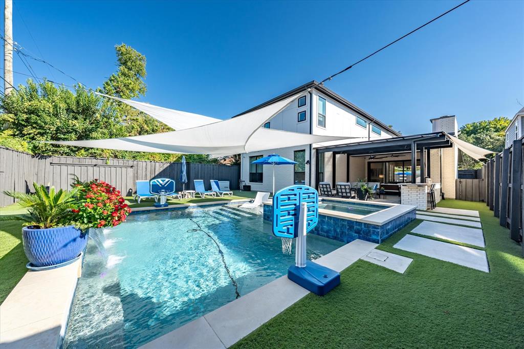 Location, Location, Location! Welcome to 5835 Vickery Boulevard, ideally nestled in the heart of Lower Greenville. This exceptional residence showcases five bedrooms, four bathrooms, and a thoughtfully designed outdoor living area perfect for year-round enjoyment. Step inside to discover soaring ceilings and abundant natural light that highlight the home’s open-concept layout. Designed with entertaining in mind, the chef’s kitchen features premium Bosch appliances, an expansive island, and a sliding glass wall that blurs the line between indoor and outdoor living. Offering both beauty and function, the home includes two spacious living areas, a large walk-in pantry, and a fully outfitted garage—ideal for the discerning sports-car enthusiast. Outside, unwind in the resort-style pool and spa, surrounded by a fully turfed backyard that’s low-maintenance and high-style. A Generac whole-home generator ensures peace of mind, while the prime location places you within walking distance of popular restaurants, lively bars, Geneva Heights Elementary School, and Tietze Park. This is modern luxury living at its finest in one of Dallas’s most sought-after neighborhoods.