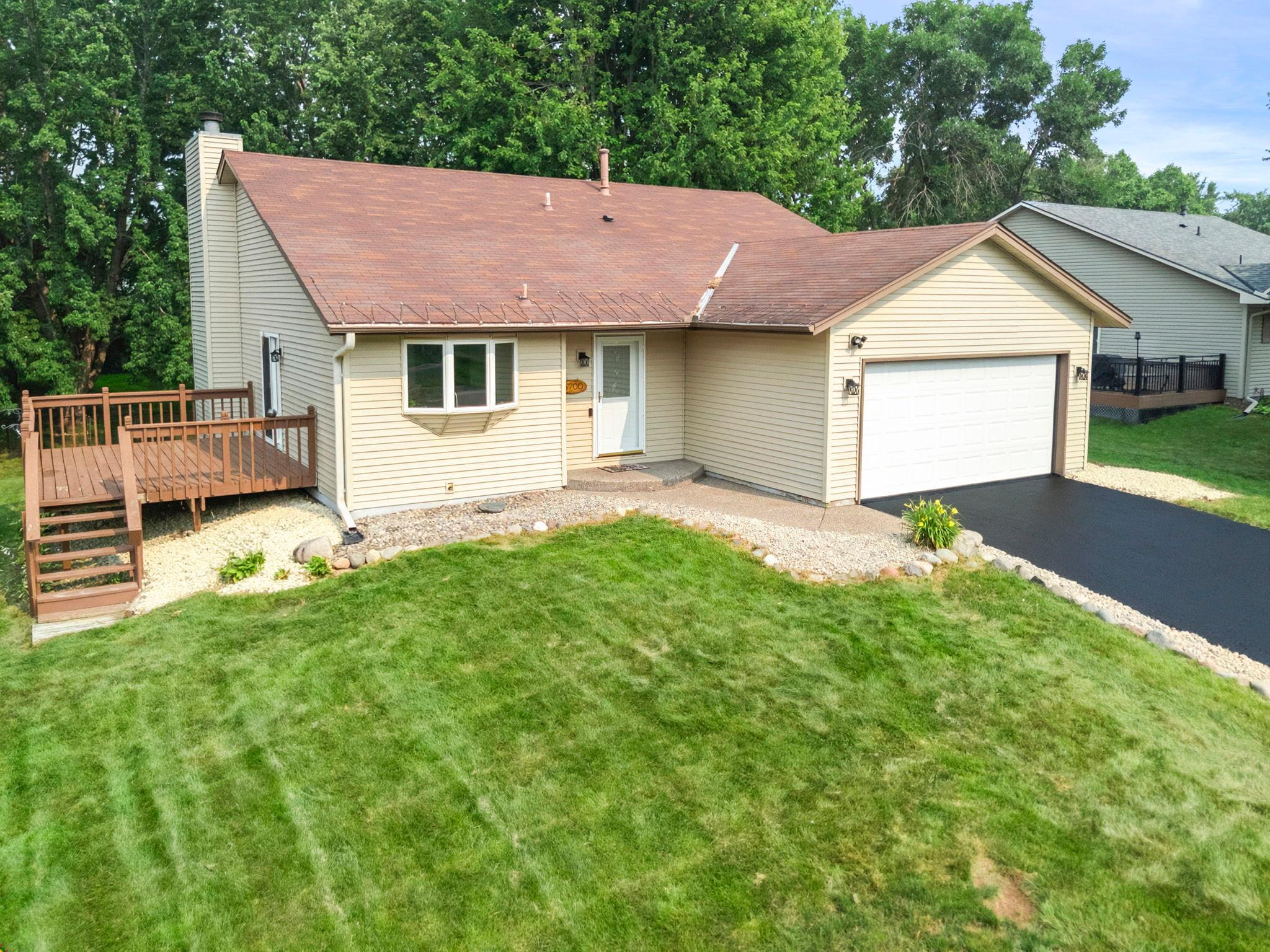Welcome to this meticulously maintained 4-bedroom, 2-bathroom home in a desirable Shoreview neighborhood, just minutes from Turtle Lake Beach, the Shoreview Community Center, shopping, dining, and nearby parks and walking trails. The functional layout features luxury plank flooring throughout the main living areas, brand-new stainless steel appliances, vaulted ceilings, and a bright dining area with access to a 15x12 deck. Upstairs offers three bedrooms with brand-new carpeting and a full bathroom, while the walkout lower level includes a spacious family room with a cozy wood-burning fireplace, a fourth bedroom, a ¾ bathroom, and a large laundry/storage room with a new washer and dryer (2025). Recent updates include a new furnace with humidifier (2023), A/C (2020), chimney inspection and cleaning (2026), all new interior and exterior light fixtures (2026), an app-controlled garage door opener, professional interior/exterior and window cleaning, and TruGreen lawn care since 2016. The home also includes a one-year Standard Heating & Air Smart Club Membership, providing biannual HVAC maintenance, priority emergency service, and waived service call fees. Don't miss this move-in-ready home in an exceptional location!