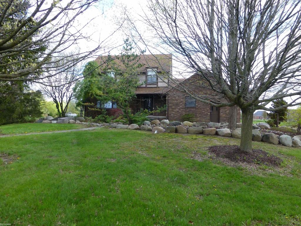 OFFERED FOR THE FIRST TIME SINCE 1995, this exquisite, quality-built colonial on 10 ACRES in the ARMADA SCHOOL DISTRICT is located CLOSE TO PAVEMENT (32 Mile) on a very well-maintained road. RARE 300-PLUS FEET OF FRONTAGE ON A BEAUTIFUL, PRIVATE 8-ACRE LAKE with a natural yard featuring a multitude of trees, shrubs and meadowlands with OVER 700 FEET ROAD FRONTAGE, offering privacy and tranquility unlike any other. Once you take in the easterly views overlooking the lake, you'll never want to leave! Paver walkways in front, leading to a large, aerated koi pond, everything set back from the road providing great seclusion. This remarkable home features all premium Andersen windows and newer Andersen doorwalls and front picture window, nostalgic pocket doors, newer roof/gutters, newer carpet and granite kitchen with hardwood flooring. Owners had pre-list inspection performed last summer (report upon request) and have had many of the conditions taken care of, including exterior stucco all repaired/replaced, along with the garage and doorwall lintels, and chimney rebricked/tuckpointed. The 2-STORY 24 X 40 BARN WITH FULL CONCRETE AND 3 OVERHEAD DOORS has also had the exterior repaired/repainted. Home is serviced with 200 AMP ELECTRIC and newer furnace; A/C unit was replaced 2024. Block basement is in excellent condition; dry with no visible issues. Natural Gas at the road - approx. $2600 to run line to house. The home has been recently cleared out and is ready for its lucky, new owners with IMMEDIATE OCCUPANCY. You won't find another property like this "“ MAKE IT YOURS TODAY!