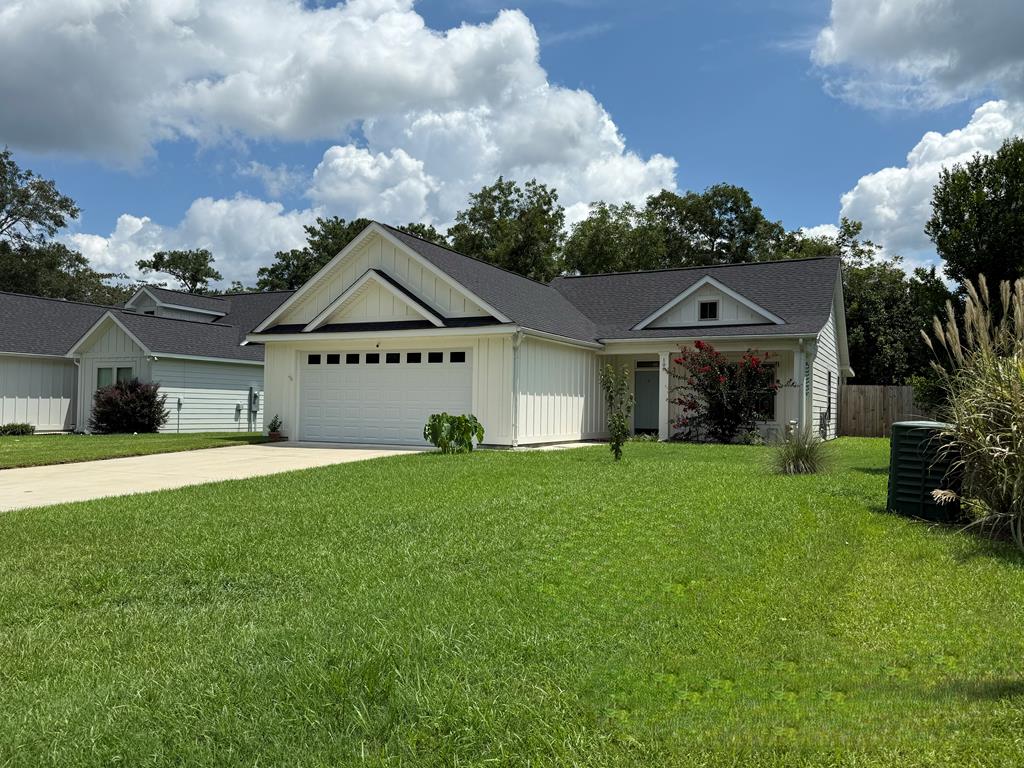 Step into this beautifully crafted home by Oracle Design, featuring an inviting open floor plan with main room vaulted ceilings. The spacious kitchen is a cook's dream, boasting double pantries, sleek stainless appliances, upgraded marble countertops, and a blend of luxury vinyl plank flooring with plush whole-room carpet rugs. Retreat to the luxurious master suite, complete with a tiled glass shower, double vanity, walk-in closets, and a private water closet. The additional bedrooms are served by a second bath with a double vanity, perfect for family or guests. Enjoy the convenience of a  laundry room with ample storage cabinetry. The double garage includes a finished storage room, providing plenty of space for all your needs. Step outside to a privacy-fenced back yard, ideal for relaxing or entertaining. This home seamlessly blends comfort, style, and functionality—ready for you to move in and make it your own!