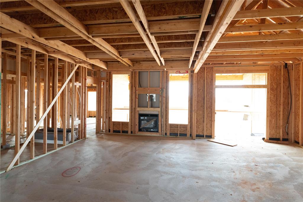 This Shiloh Bonus Room floor plan includes 2,805 Sqft of total living space, which features 2,450 Sqft of indoor living space and 355 Sqft of outdoor living space. There is also a 610 Sqft, three-car garage with an in-ground storm shelter installed because, at Homes by Taber, safety is never an option. This defining home offers 4 bedrooms, 3 bathrooms, 2 covered patios, and a large bonus room! The spacious living room features a stunning coffered ceiling with crown molding and a ceiling fan, a stacked stone surround center gas fireplace, wood-look tile, large 7’ windows, rocker switches throughout, and Cat6 wiring. The high-end kitchen supports custom-built cabinets to the ceiling with under cabinet lighting and cabinet hardware throughout, impressive tile backsplash, built-in stainless-steel appliances, a center island equipped with a trash can pullout, impeccable pendant lighting, a walk-in pantry, and 3 CM countertops. The primary suite offers a sloped ceiling detail, windows, a ceiling fan, our cozy carpet finish, and 2 separate walk-in closets. The attached primary bath features separate vanities with framed mirrors, 3 CM countertops, a free-standing tub, a private water closet, and a huge walk-in shower! Secondary bedrooms feature high ceilings with a ceiling fan, carpeted flooring, windows, and sizeable closets. Property is fully sodded with an in-ground sprinkler system in both yards! The covered back patio offers perfection with its wood-burning fireplace, gas line, and TV hookup. Other amenities include Healthy Home technology, a tankless water heater, a whole home air filtration system, R-44 Insulation, and more!