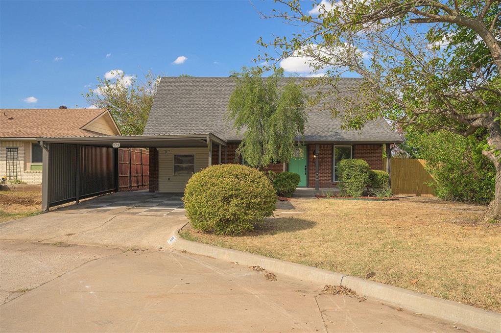 5 Bedrooms • 2 Full Baths • 1,698 Sq Ft • New Kitchen • New Bathrooms • New Water Heater • New Carpet & Ceramic Tile • Crown Molding • Carport • 2 Storage Sheds • Cul-de-SacFully Updated Two-Story at the End of a Cul-de-Sac. This Moore home has been renovated top to bottom, and the work shows the second you walk in. The main level opens to a living room with crown molding, a ceiling fan, and an oak staircase with crisp white risers. The new kitchen brings white shaker-style cabinets with matte black hardware, granite countertops, a stacked tile backsplash, open wood shelving, and stainless steel appliances, including an electric range, over-the-range microwave, and dishwasher. The dining area has a geometric pendant light and a sliding glass door to the back patio.The primary bedroom is on the main level with a walk-in closet and a private bath featuring a tiled walk-in shower, a new vanity with a marble-look top, and a new toilet. A fifth bedroom sits off the kitchen beside the laundry room, which has its own exterior door. Upstairs are three more bedrooms, all with new carpet, and a full bath with marble-look tile around the tub and shower, a granite vanity, and new fixtures. New lighting, plumbing fixtures, and door hardware run throughout, along with a new water heater.Outside, the brick and siding exterior has a covered front porch, a flagstone walkway, and a metal carport. The fenced backyard adds a concrete patio, mature trees, and two storage sheds for tools and gear. Minutes from shopping, dining, and I-35. Five bedrooms, two baths, and nothing left to fix. Why keep renting?