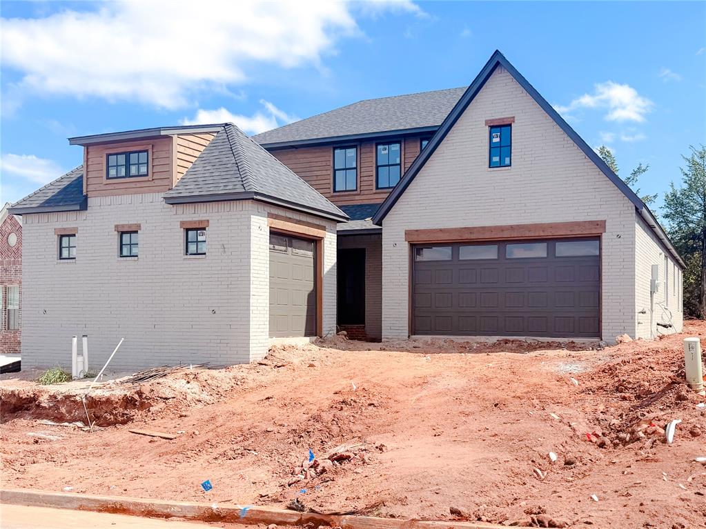 Special Promotion Available! For a limited time, enjoy $7,500 Your Way on select under construction or completed homes in Town Square or Bison Ridge communities. Use it towards a rate buydown, cash to close, design upgrades, appliance package, storm shelter options, or combine select incentives to fit your lifestyle best. Promotion available through October 31, 2026. Striking Modern Painted Tudor home in new Bison Ridge community! Our Holly plan has the perfect layout with 4 bedrooms, 3.5 baths, a large kitchen, dining space, a dedicated study with French doors, an upstairs game room, and a 3-car garage. The open concept floor plan draws you from the entryway into the living room that is filled with natural light from the large windows and features a painted brick fireplace with media built-ins. You will love the site-finished wood flooring throughout the main entertaining areas of the home! The primary suite has separate vanities, a free-standing tub, an oversized spa glass shower, and a walk-in closet that connects near the laundry. Home under construction - finishing Winter 2026.