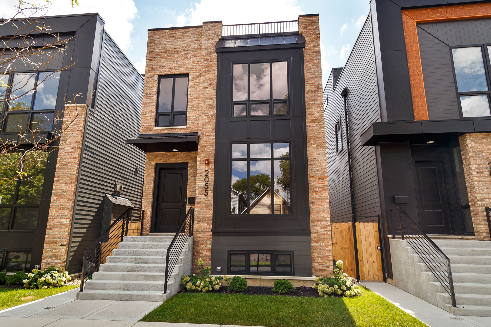 Construction is complete on another stunning home in our 7-home development in the heart of West Town, The Race Collection! Contemporary facade with clean lines and brick accents. Extra wide floor plan with high end fixtures and finishes. Modern, sun filled spaces with oversized windows. Open concept main-level perfect for entertaining. Combined living/dining area features direct vent gas fireplace with floor to ceiling surround, and built-in display cabinet. Chef quality kitchen includes top of the line Sub-Zero and Wolf appliances, custom cabinetry with quartz countertops, butler pantry, and island with waterfall counter and bar seating. Expansive family room with second gas fireplace and a wall of back windows. Upper level primary suite with two WIC's with custom organizers, and ensuite bath featuring a freestanding tub, frameless glass shower, dual sinks, and heated flooring. Two additional bedrooms, full bath with tub and dual sinks, and laundry with Samsung washer/dryer and sink complete the level. Third floor wet bar opens to a roof deck with outdoor fireplace. Finished lower level features radiant heated flooring and includes a spacious recreation room complete with wet bar, fourth bedroom with large WIC, full bath with shower, utilities, and luxury vinyl plank flooring. Rear deck with staircase to garage roof deck with pergola. Prime West Town location close to restaurants, shopping, entertainment, and Smith Park! Easy access to public transportation and other great neighborhoods.
