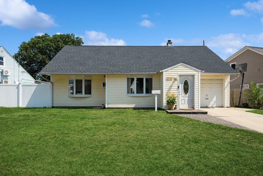 New to Market!  Perfect starter home ready for your personal touch and to be enjoyed for years to come!  Located in the highly desirable Bethpage neighborhood, with award winning Island Trees Schools!   This 4BR Omega style cape features a brand new architectural roof, updated siding, new concrete sidewalks, many updated windows (some Anderson), and a very versatile floor plan.  Front entry foyer/closet, spacious living room with bay window and LV flooring, Large sunlit kitchen with separate dining area with new stainless steel dishwasher and microwave, all nice-sized bedrooms, full bath on main level with the ability to easily add another upstairs.  Oversized property which is fully fenced with privacy PVC, a large patio great for entertaining, attached garage, and above ground pool (offered as a gift).  Taxes are only $8718 after STAR!  SO much potential in this adorable home, this is your chance to finally find that affordable home and make it your own!