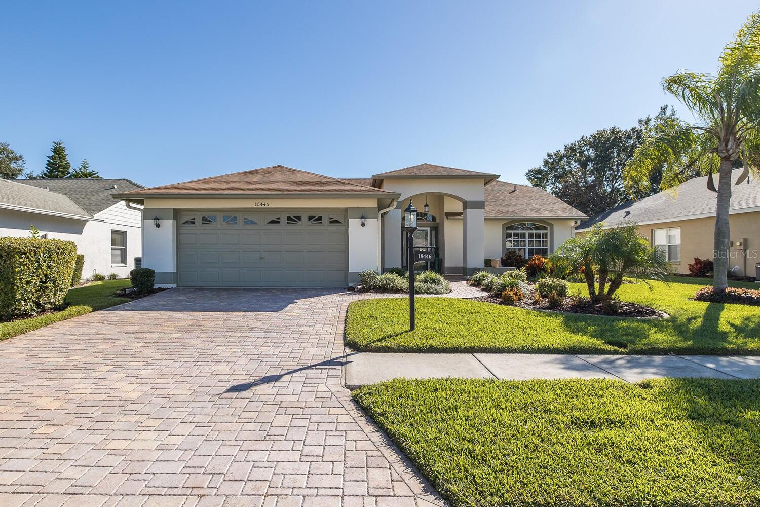 STUNNING! Completely Remodeled in 2025 Highly Desirable Bermuda Model Home Now Available! A Must See 3 Bedroom, 2 Full Bath, 2 Car Garage Home Located on the 14th Fairway That's Been Recently Remodeled from Top to Bottom. Features and Upgrades Include the Ever Popular Open Kitchen to Living Room to Dining Room Floorplan. High Textures Ceilings and Walls. Beautiful REAL Hard Wood Plank Styled Flooring Through Out. Beautifully Done Upgraded Kitchen Offers Higher End REAL Wood Cabinetry with Pull Outs, Custom Tiled Backsplash, Granite Counter Tops, Kitchen Isle, Recessed Lighting, Double Door Pantry and All Newer Top of the Line Stainless Steel Appliance Package. Kitchen, Eat in Kitchen Area, Living Room with Four Sliding Glass Doors Offer Unobtrusive Views of the Spacious Lanai and Golf Course. Larger Primary Bedroom and En-Suite Feature Extended Wood Flooring, Custom Lighting and Drapery, Three Additional Windows and Sliding Glass Doors Offer Plenty of Additional Natural Light. Walk In Closets, Custom Installed Wood Double Vanity Sinks, Quartz Counter Top, Tiled Flooring, Inlayed Sinks, New Faucets, Dual Mirrors and Light Fixtures. Custom Built Inlayed Tiled Walk In Shower, Rail Bars, New Fixtures and a Barn Door Custom Sliding Glass Door. Larger Second and Third Bedroom Offer the Extended Wood Flooring, Built In Closets and Both Offer Easy Access to the Updated Full Sized Second Bath. Primary Suite, Living Room and Kitchen Offer Access to the Spacious Oversized 28 X 18 Screened In Lanai Which Offers a Great Area to Relax, Enjoy the Golfing Views and Perfect for Family BBQ'S and Entertaining Family and Friends. You’ve Worked Hard all your Life and You’ve Earned the Opportunity to Enjoy your Retirement Surrounded by Friends and Neighbors in a Safe and Secure Gated Community with 24-hour Security. Heritage Pines is 55+ Deed Restricted Community in Hudson, Florida that is Affordable, Beautifully Maintained and Allows you to Live your Retirement in the Style you Choose. Whether that Lifestyle is Active or more Relaxed, you can find it here at Heritage Pines.