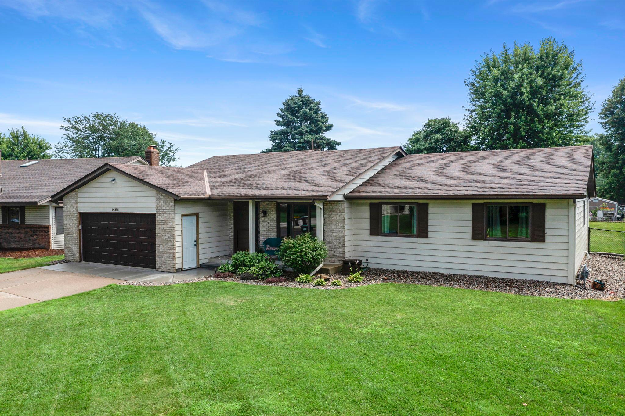Charming 3BR/4BA home in a peaceful Apple Valley neighborhood, just steps from parks, trails, shopping, dining, and major highways. Enjoy a spacious kitchen with tile floors, stainless steel appliances (new oven & microwave), painted oak cabinets, and a breakfast bar. The dining area opens to a large 20x20 deck, ideal for entertaining. Main-level features include two living areas, a cozy gas fireplace, hardwood floors, a convenient laundry room, and access to the attached 2-car garage via a mudroom-style entry. All bedrooms on one level, including a primary suite with walk-in closet and updated ¾ bath. The finished lower level offers a family room, ¾ bath, large rec space with stove, bonus room, and ample storage. The fenced backyard boasts a deck, patio, shed, and beautiful landscaping. A must-see!