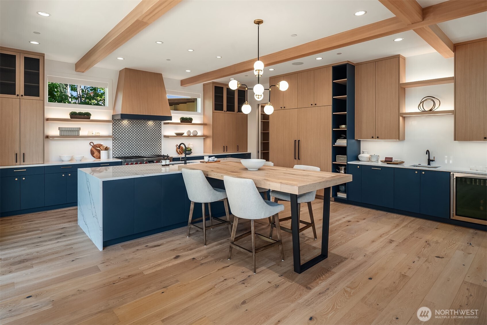 Wooden dining table attached to the oversized island