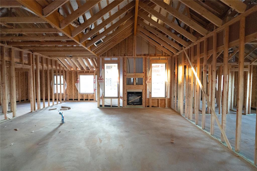 This Hummingbird floor plan features 2,025 Sqft of total living space, which includes 1,800 Sqft of indoor space and 225 Sqft of outdoor living. There is a 565 Sqft, three car garage with an in-ground storm shelter installed. This home offers 4 bedrooms, 2 bathrooms, 2 covered patios, and a large utility room. The great room welcomes a breathtaking cathedral ceiling, a gas fireplace with our stacked stone surround detailing, large windows, rocker switches throughout, wood-look tile, and Cat6 wiring. The high-end kitchen has 3 CM countertops, custom-built cabinets to the ceiling with cabinet hardware installed throughout and under cabinet lighting, stainless steel appliances, a 5-burner cooktop, vogue tile backsplash, stellar pendant lighting, a corner walk-in pantry, and a large center island equipped with a trash can pullout, sink, and dishwasher. The elegant primary suite has a sloped ceiling detail with a ceiling fan, windows, Cat6 wiring, and our cozy carpet finish. The attached spa-like bath includes a dual sink vanity with framed mirrors, TWO spacious walk-in closets, a roomy European walk-in shower, and a free-standing tub. Secondary bedrooms feature high ceilings with ceiling fans, windows, spacious closets, and carpeted flooring. The covered back patio offers a wood burning fireplace, a TV hookup, and a gas line for your grill. Other amenities include Healthy Home Technology, a fresh air ventilation system, a tankless water heater, R-44 insulation, and more!