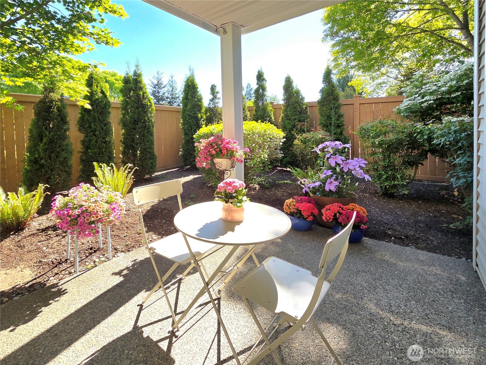 Welcome to this beautifully updated 2-bedroom, 2-bath ground-floor condo in the heart of Lakeland Hills — one of Auburn’s most desirable communities.    Step inside and immediately feel the warmth and openness of the home. Natural light pours through oversized windows, highlighting the seamless wood-look flooring that runs throughout the entire home.    The thoughtfully updated kitchen features a lowered, flat quartz countertop that opens beautifully into the dining and living areas, creating a bright and connected space ideal for both everyday living and entertaining.    One of the home’s most special features is the private patio retreat. Fully enclosed with wood fencing and surrounded by mature arborvitae, lush greenery, and colorful seasonal blooms, this outdoor space feels more like a peaceful backyard garden than condo living.    Located in the highly sought-after Lakeland Hills community, residents enjoy the convenience of nearby parks, scenic walking trails, Lakeland Town Center shopping and dining, plus easy commuter access to Hwy 167, Hwy 18, and the Sounder Station. A rare opportunity to own a condo that truly feels like home.