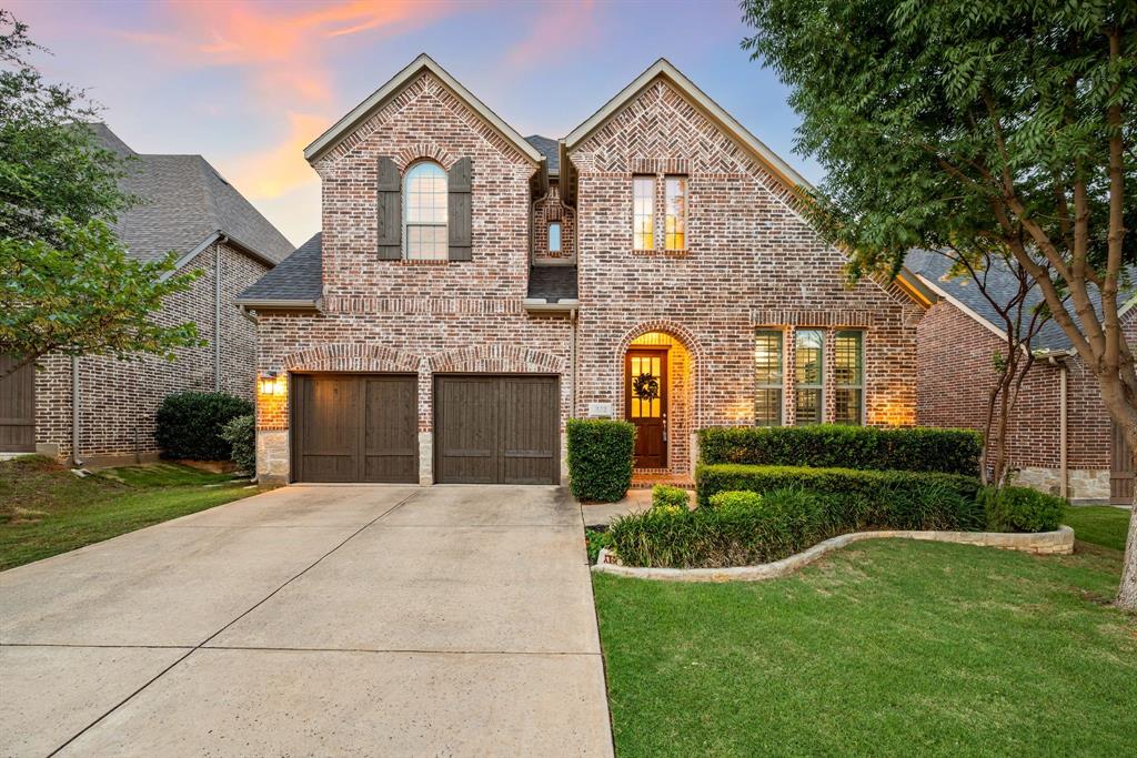 Step into this beautifully crafted Darling Homes residence, where soaring ceilings and rich hardwood floors welcome you into an open-concept layout designed for modern living. The main floor features a private executive office, a spacious family room with a striking floor-to-ceiling stone fireplace, and a chef-inspired kitchen complete with a large center island with breakfast bar seating, stainless steel appliances, a gas cooktop, and a walk-in pantry. The private primary suite offers a serene retreat with a luxurious garden tub and a generous walk-in closet. Upstairs, you'll find a large game room, three additional bedrooms, and two full bathrooms—perfect for family or guests. Enjoy the outdoors in your spacious backyard, featuring a large covered patio and plenty of room for kids or pets to play. The home also includes a 3-car garage for ample storage and parking. Conveniently located between Dallas and Fort Worth and just minutes from DFW International Airport, with premier shopping, dining, and entertainment nearby in Grapevine and Southlake.