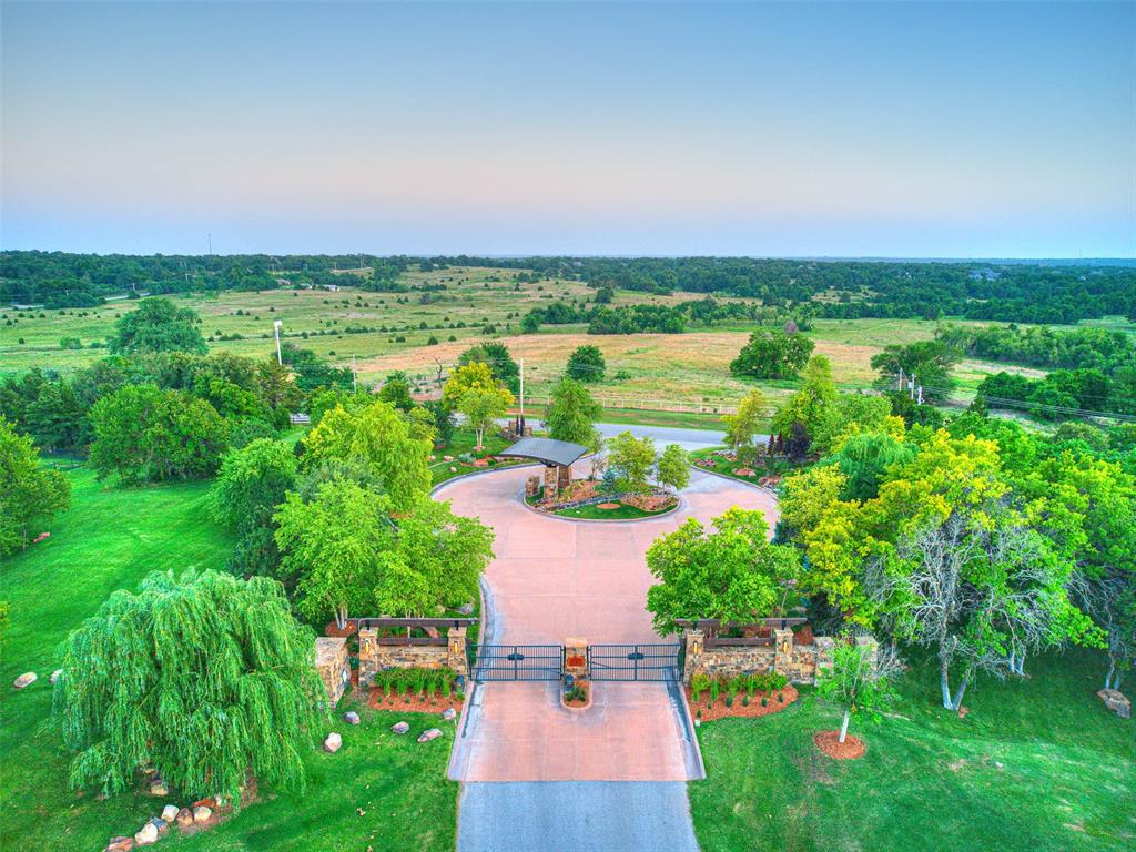 Enjoy the picturesque setting & abundant beauty from the lush, wooded countryside afforded by the exclusive gated community of Forest Creek Estates in East Edmond. The sophistication & uniqueness of this development is immediately showcased upon arrival. Extensive landscaping, large boulders & waterfalls set the tone for the rustic & modern Colorado inspired mountain scenery. The 5 acre lake & 15 acre nature preserve will inspire you to enjoy the ability to disconnect & take full advantage of the serene amenities offered in this environmentally friendly community. This land was developed & designed specifically for those who wish to create their own distinctive oasis. Located just minutes from the continuously developing I-35 corridor, the convenience achieved at this location adds to the expansive list of qualities this development offers to future residents. See attached for covenants & approved builder list. Developer will not consider other builders at this time.