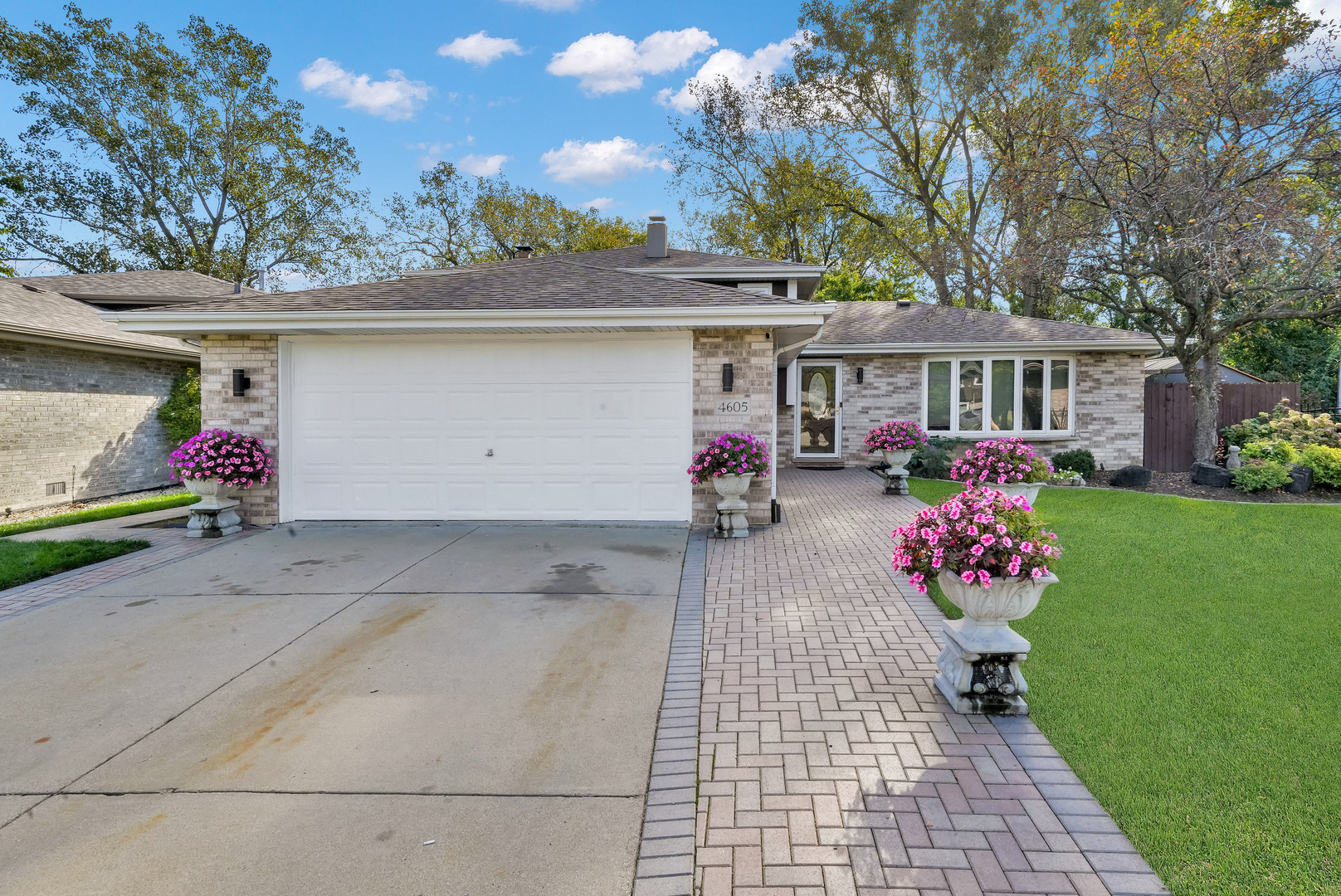 Welcome to 4605 West Spencer Lane! Located in a highly desirable Alsip neighborhood with seamless expressway access, this stunning bi-level home combines high-end luxury with an extraordinary outdoor oasis. Step inside to rich hardwood floors, dramatic ceilings, and a renovated kitchen featuring beautiful granite countertops. Exquisite tile work flows throughout, showcasing bathrooms with custom tiling, sleek stand-up showers, and glass sliding doors, while the large family room features a cozy fireplace, well-maintained HVAC, washer, dryer. The fully fenced backyard is designed for entertaining, complete with a pool, a stone patio with a gazebo, an included canopy, two storage buildings (including a custom shed), and gorgeous decorative pottery lining the driveway. Offering versatile space, prime convenience, and turnkey inclusions, this Alsip gem is a must-see!