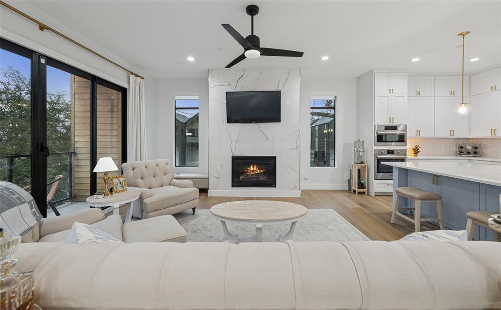 One of the most desirable floor plans in the neighborhood, this corner residence stands out for its spacious room sizes, abundant natural light, and exceptional outdoor living. Expansive windows brighten the home, while a custom pergola creates an inviting extension of the living space outdoors.The second level features an open-concept design ideal for both everyday living and entertaining, complete with a fireplace, a dedicated dining area with built-ins, and a well-appointed kitchen. The primary suite offers a generous layout and a private ensuite bath. On the third floor, a secondary bedroom, built-in hallway shelving, and a full laundry room provide comfort and convenience. A first-floor bedroom, currently serving as a home office, offers excellent flexibility to suit a variety of needs. The turfed backyard provides a low-maintenance setting perfect for relaxing or hosting guests. Ideally located with easy access to major freeways, SMU, Baylor, Uptown, and the popular restaurants and shops along Greenville Avenue, this home combines style, function, and an exceptional Dallas location.