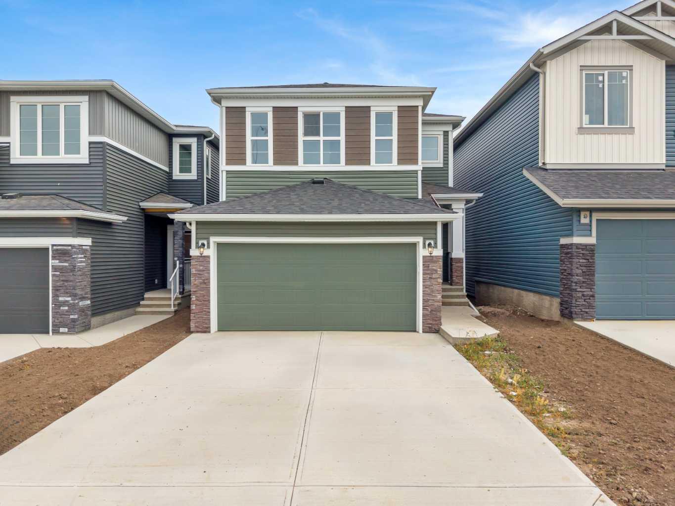 ***Stop by ShowHome for Access @ 21 Amblefield View NW (M-TH 2-8PM)*** Welcome to 72 Amblefield Grove NW, a stunning family home that perfectly combines elegant design, modern comfort, and thoughtful functionality. Situated on a desirable west-facing homesite, this property offers over 2,000 sq. ft. of living space across all levels, filled with natural light and premium finishes throughout.
Step inside and immediately notice the sense of openness created by the 9-foot main floor ceilings and large windows that frame the bright, airy great room. The main level’s open-concept layout is anchored by a cozy gas fireplace—the perfect focal point for gatherings with family and friends. The built-in tech space on the main floor provides a practical workstation or homework nook, adding convenience to your daily routine.
The heart of the home is the chef-inspired kitchen, featuring 42-inch upper cabinets, sleek quartz countertops, a central island with seating, modern tile backsplash, and stainless steel appliances. The upgraded cabinetry provides abundant storage, while the thoughtful layout ensures seamless flow between cooking, dining, and entertaining areas. Hardwood flooring throughout the main level adds timeless warmth and sophistication.
Upstairs, the home continues to impress with a smart, family-friendly design featuring three spacious bedrooms and a central bonus room—ideal for movie nights or a kids’ play area. The luxurious primary suite is a true retreat, offering a 5-piece ensuite with dual vanities, a deep soaker tub, separate shower, and a generous walk-in closet. The upper floor also includes a full bathroom and tiled laundry area, combining comfort with practicality.
The lower level features a sunshine basement with large windows that bring in natural light, creating the perfect canvas for future development. With a 9-foot foundation and 3-piece rough-in for a future bathroom, this space is ready to be transformed into a recreation area, gym, or guest suite—whatever suits your lifestyle best.
Outside, the west-facing backyard provides the ideal setting for evening relaxation and entertaining. Whether enjoying sunset barbecues or watching the kids play, this space offers both privacy and serenity.
Located in a family-friendly northwest community, this home provides easy access to nearby schools, parks, pathways, shopping, and major routes for a quick commute anywhere in the city.
Combining thoughtful design, high-end finishes, and a flexible layout, 72 Amblefield Grove NW delivers a modern lifestyle perfectly suited for today’s family. From its sunlit interiors and elegant details to its prime west-facing lot, this is a home that truly has it all.