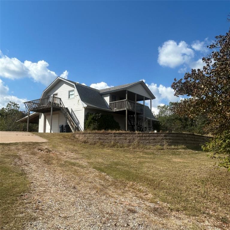 Bring your vision to this one-of-a-kind property nestled on 5 wooded acres just minutes from Lake Draper. The home sits high on a hill, offering beautiful panoramic views and the potential to create a truly special retreat surrounded by nature.

The existing structure features a garage on the entire lower level and a living area above. The property will require significant renovation — the roof needs replacement, there has been water damage inside, and the septic system is not currently operable.

With the right updates, this could become an ideal lake-area residence, weekend getaway, or investment property. The land itself provides the true value here — private, elevated, and full of mature trees.

Whether you choose to restore the existing home or start fresh, this property offers the space, seclusion, and setting rarely found this close to Oklahoma City and Lake Draper recreation areas.