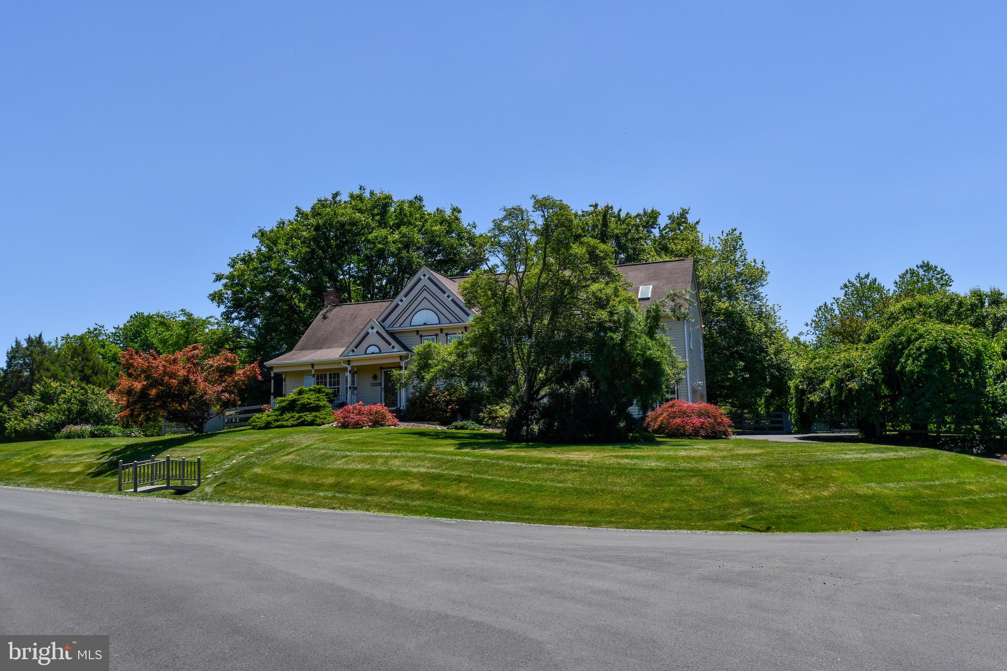 There is a reason why this neighborhood has always been so appealing and desirable. It has a rural country feeling but is close to everything. You will quickly appreciate the tranquility that comes over you as you drive up to this wonderful house. The house is sited on a .69 acre lot that is surrounded by lush green grass and smartly landscaped with mature flowering trees and shrubbery. The sellers have loved raising their family here. As the family grew, so did the house. In 1989 a two-story addition was added. The upper level received a generously sized primary bedroom with cathedral ceilings, a wonderfully sized walk-in closet and large bathroom. The primary bath was opened to the studs in 2012 and configured as it is today; glass enclosed shower, jetted tub, stylish stone sinks and surrounded with ample storage. The lower level was finished with the over-sized 500 sf two car garage that everyone appreciates. Another 2-story addition was added off of the kitchen in 2012. This provided the 450+ sf sunroom with the four skylights, ten large windows and two sets of French doors, one of which leads to the Trex and vinyl deck that floats in the trees. Underneath this space is the home office that is so useful in today’s work-at-home environment; built-in shelves with cabinets, two large windows, separate doors to the driveway and into the garage. A 150-sf storage room adjoins the office. The sunroom looks out at the cedar fenced rear yard that is ideal for play and entertaining. Please refer to Document Folder for the long list of upgrades, replacements and improvements that the owners have done to the house. It’s truly impressive. When given the choice, they always opted for the premium selection. Prior to putting the house on the market, the kitchen received a refresh with new cabinet and drawer handles, quartz countertops with an under mount sink. The sellers have given the house a fresh coat of paint so that the new owners can move in and immediately start enjoying their new house. While the house has a Reston mailing address, it is not part of the Reston HOA. It is, however, in the Langley school pyramid. Please note that the septic is rated for a three bedroom house. A recently conversation with the county indicated that the system could be enlarged should the household need require it. All in all, this house is the total package; a special community, captivating curb-appeal with groomed and maintained landscaping and improved with smart additions that provide generous living space. Hurry, this move-in fresh house won’t last long.