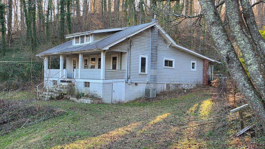This charming 1936 Bungalow is ready for a new owner to bring it back to its former glory.  Featuring two bedrooms, a bonus room, and one bath, it sits on over 6.5 acres of unrestricted land.  Discover the potential this home offers in a fantastic Sylva, NC location.