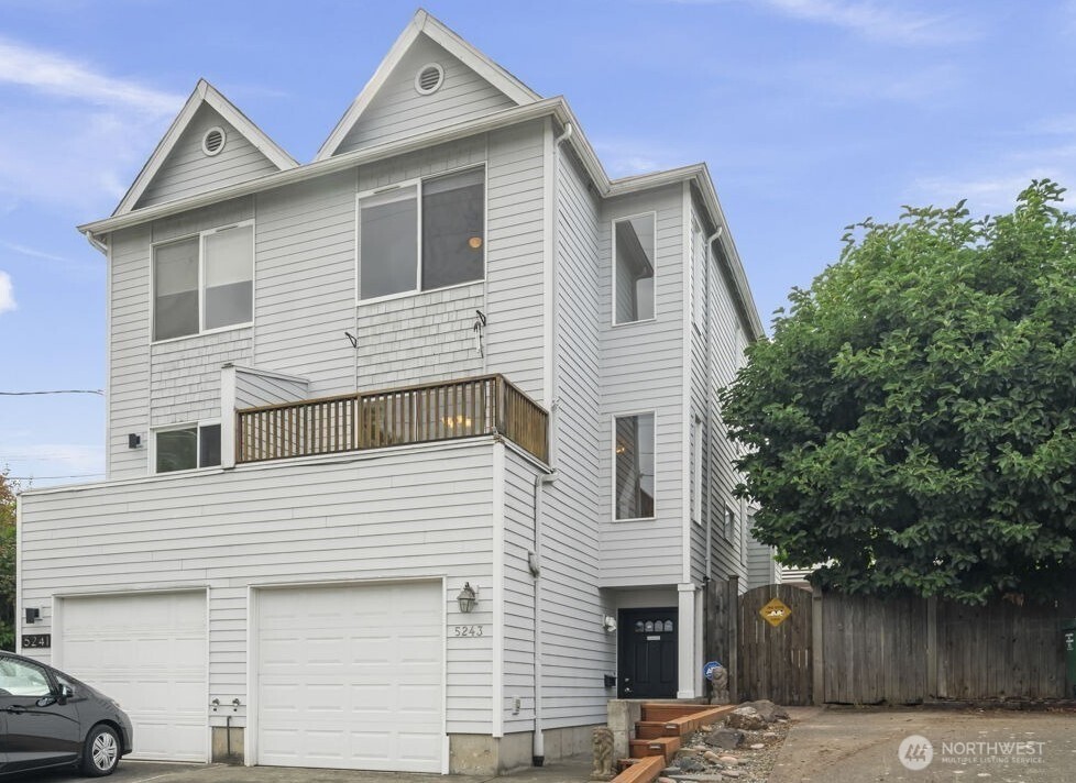 An urban oasis awaits - right on the Burke-Gilman Trail, just steps from the Burke-Gilman Playground Park! Located right across the street from Metropolitan Market and just an 8-minute walk to Seattle Children’s Hospital. Interior just painted and hardwood floors just redone so the home is fresh and ready for you! This light-filled home features an open-concept main level with true hardwood floors, a river rock gas fireplace, a half-bath, and a wonderful deck. The top floor boasts a primary suite with a full bath, plus a second bedroom and full bath. The lower level offers a private bedroom with an en-suite bath. Four total bathrooms! Also an attached one car garage, plus driveway parking for two more cars. Outside, enjoy a fully fenced backyard with a patio and private hot tub. Minutes from The University of Washington, Magnuson Park, and the premier shopping and dining at University Village. Easy access to 520 and I-5. This is perfect Seattle living!