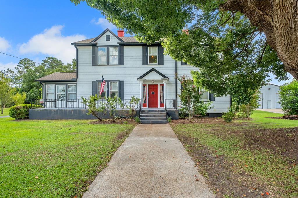 Charming and beautifully renovated 1905 home with 4BR/3.5BA and nearly 3,900 sq. ft. on 1.32 acres in Cairo. Private setting just minutes from downtown, shopping, and schools. Features include refinished hardwood floors, newer roof (2020), hot water heater (2022), and updated gutters/downspouts (2020). Spacious rooms blend historic charm with modern updates, and the flexible upstairs layout is ideal for large families or homeschooling. Outdoor highlights include a heated lagoon-style pool (2020), a 20x40 detached building for workshop, storage, or hobbies, and a 50x50 powered storage building. The property offers apple, pear, tangelo, tangerine, lemon, lime, and concord plum trees, plus space for a garden. Fully fenced with two gated entrances. Many updates already completed—ready for its new family to add personal touches and make it their own.