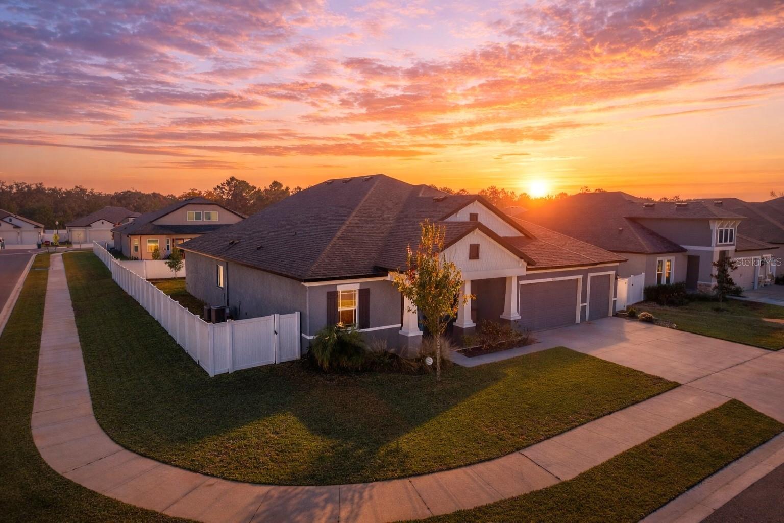 BETTER THAN BUILDING — STUNNING 2023 WILLIAM RYAN CRAFTSMAN | 5 BED + HUGE FLEX (POSSIBLE 6TH) | 4 BATH | 3-CAR | IMPACT WINDOWS | ENERGY EFFICIENT If you've been planning to build because you need space, upgrades, and a home that can grow with your family—this is the one that lets you skip the delays, rising costs, and stress... without giving up the ''new home'' feel. Welcome to this gorgeous 2023 William Ryan Craftsman Joyce Model in the boutique community of Whiting Estates, featuring a low 95/month HOA and an ideal location with quick access to the Suncoast Parkway for an easy Tampa commute. Set on a corner lot with sidewalk-lined streets, this home brings all the charm with a classic front porch, and all the function with a large vinyl-fenced backyard and back porch—perfect for kids, pets, playtime, parties, or peaceful evenings outside. Inside, it's bright, open, and built for real life with 10' ceilings, 8' interior doors, and impact windows throughout. The floorplan offers five generously sized bedrooms, four full bathrooms, and an incredible upstairs flex room (approx. 675 sq ft) with a closet—ideal for a game room, media room, teen retreat, home office, or a true 6th bedroom as your needs change. At the heart of the home is a showpiece gourmet kitchen designed for busy mornings and family gatherings alike, featuring white shaker cabinetry with crown molding, soft-close drawers, a gray shaker island, under-cabinet lighting, quartz countertops, and a timeless beveled subway tile backsplash. You'll love the high-end stainless appliance package, including a double oven (with convection + microwave capability), cooktop, chimney-style vent hood, double-drawer refrigerator, a large pantry, and an undermount single-bowl stainless sink. The primary suite is a true retreat with room for a sitting area and a beautiful bay window that pours in natural light. The spa-like bath includes a soaking tub, walk-in shower, dual square undermount sinks, shaker cabinetry, quartz countertops, and a huge walk-in closet. PLUS: this home is already set up for the future with foam-injected block walls for energy efficiency, 80-amp pool pre-wire, and laundry tub pre-plumbing—plus the peace of mind of a transferable structural warranty. Located in the desirable Nature Coast school zone and just minutes to local favorites like Anderson Snow Sports Complex and the Suncoast Bike Trail, this home checks the boxes that families usually start building for—space, quality, efficiency, and flexibility—already done and move-in ready. Schedule your private showing today!