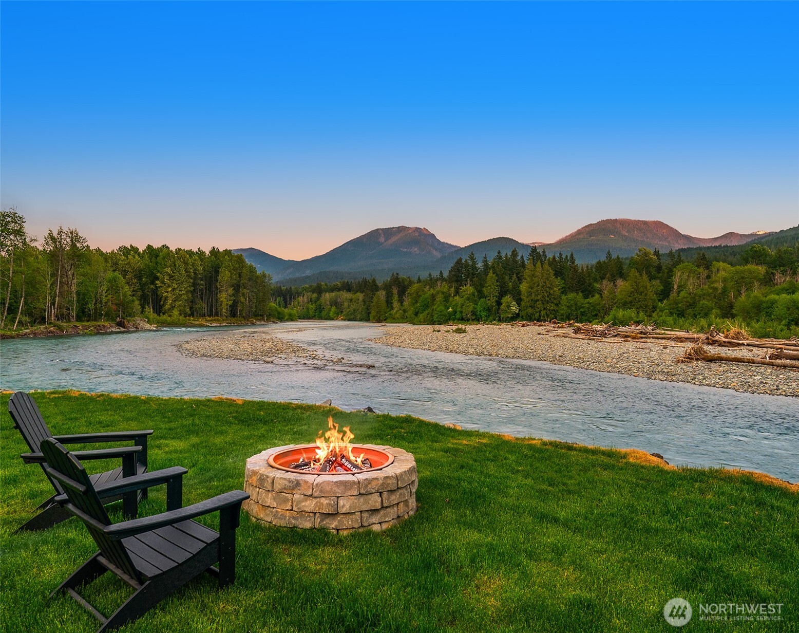Picture-perfect short term rental with stunning dynamic Cowlitz River views from nearly every room. Envision the viral marketing opportunity with influencer posts showcasing guests enjoying the hot tub with 200-degree views of the river. This fully remodeled cabin features LVP throughout, slab concrete countertops, and three ductless mini-splits for guest comfort regardless of the season. After a day on the slopes at White Pass or hiking Mt. Rainier National Park -- both 25 mins away -- enjoy relaxing by the riverfront fire pit, then cozy up on the sofa for a movie with the wood burning stove perfectly warming the cabin. The newly re-sodded yard is fully fenced, ideal for welcoming guests with pets. The brand new massive shoreline armoring created an ideal elevated riverfront relaxation vista. And, the newly rebuilt and restained deck is picture perfect for enjoying your mountain retreat from sunrise to sunset. As a member of the High Valley community, you'll have access to the golf course, pool, and clubhouse. Sold almost fully furnished for a turnkey STR investment.