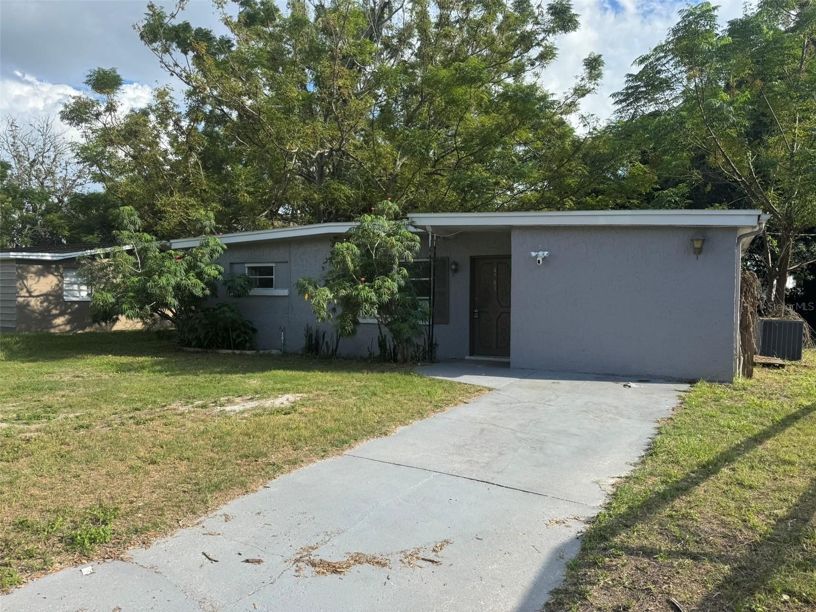 Classic 1962 Florida ranch in the established Grove Park community of New Port Richey. This VA-owned 3/2 single-family home offers approximately 1,000 sq ft of living space on a roughly 6,000 sq ft lot, with no HOA or CDD restrictions. Sold as-is; a solid opportunity for buyers or investors to add value in a growing Pasco County market minutes from US-19, shopping, and the Gulf beaches. Buyer to verify all measurements, permits, and condition during the inspection period. Property sold AS-IS.