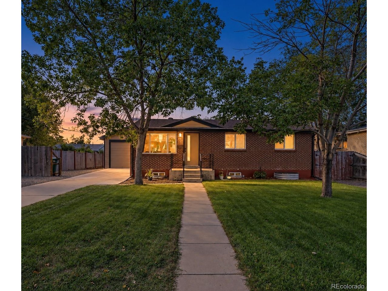 Beautifully remodeled, move in ready, and complete with a rare four car garage, this home offers an incredible combination of modern updates, flexible living space, and exceptional parking. Step inside to a bright, open interior featuring quartz countertops, a kitchen island with pendant lighting, brand new appliances, new vinyl flooring and fresh interior paint throughout the main living areas.  The main living area offers room to create both a comfortable living room and a dining area if desired. Both bathrooms have been beautifully remodeled with stylish, modern finishes. The full finished basement features a family room, two bedrooms with egress windows, a remodeled bathroom, new carpet, and a laundry room with abundant storage. A newer furnace and central air conditioner, new hot water heater, updated electrical, and new electrical panel provide added comfort, efficiency, and peace of mind. Outside, enjoy a private backyard, beautiful landscaping, and a brand new sprinkler system. With no HOA, you have more freedom to enjoy the property and its many possibilities. The location is equally impressive. Situated directly across from the Englewood Recreation Center campus and beside Jason Park, the home is near the Oxford light rail station, South Platte River Trail, River Point shopping and dining, Costco, Target, and Santa Fe Drive. Enjoy convenient access to downtown Englewood, downtown Littleton, downtown Denver, and destinations throughout the metro area. The showstopper! The incredible 936 square foot, four car garage features an oversized door and room for vehicles, a workshop, equipment, storage, recreational toys, or all of the above. The expansive driveway provides additional off street and RV parking, with space for up to 10 vehicles throughout the property. Beautifully updated, ideally located, and offering low property taxes with a garage and parking setup that is incredibly hard to find, this home is truly one of a kind!