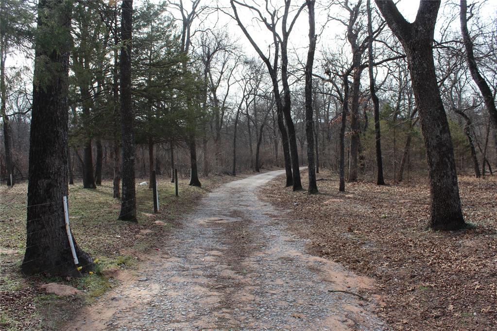 Beautiful 5 acres in Norman school district with a mobile home.