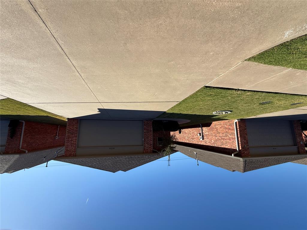 This charming 2 bedroom home is nestled within the gated Santa Fe Villas community, designed for but not exclusive residents aged 55 and older.  This extrememly well kept 2 bed, 2 bath home offers spacious rooms, high end finishes and so much more.  The large kitchen adjoins the spacious living room with fireplace.  The master bed is one the back of the home and offers a large closet and bathroom.  The additional bedroom is quite large and has a nice sized closet.  All of this in addition to a large above ground storm shelter in the garage and a large back patio to enjoy make this the home for you!