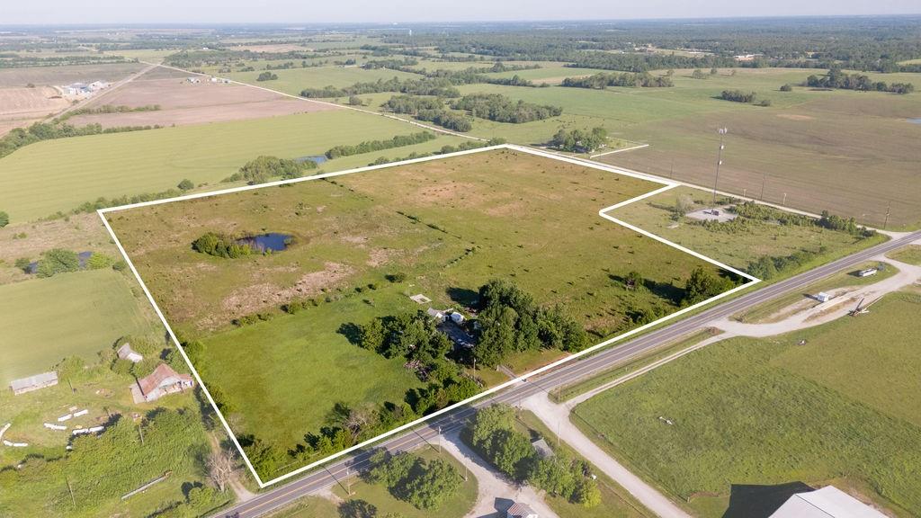 It is not often that a home with barns and large acreage comes on the market. The quaint 3 bed, 2 bath home sits right off the paved road just north of Golden City and is surrounded by 34 +/- acres of pasture with a pond. This property has everything you need to start a thriving homestead out of the big city. A 30’x40’ shed with concrete floors and a large overhead door provides cover for farm equipment, feed, and anything else you need stored out of the elements. A 25’x34’ barn provides more than enough space for small livestock, a couple of horses, or a dairy cow or two. A 12’x15’ garden shed is just the right size for storing a tiller, mower, and all those tools you need to keep out of the rain.The pasture is mostly open with a small pond on the south side providing year-round water for livestock. A gravel road runs along the north end of the pasture, which allows multiple points of access for hay equipment in the spring. If you are looking for a quiet place outside of the city where you can sit on your porch, listen to Bobwhite quail whistle their song while your cows graze the pastures, this is the place for you.