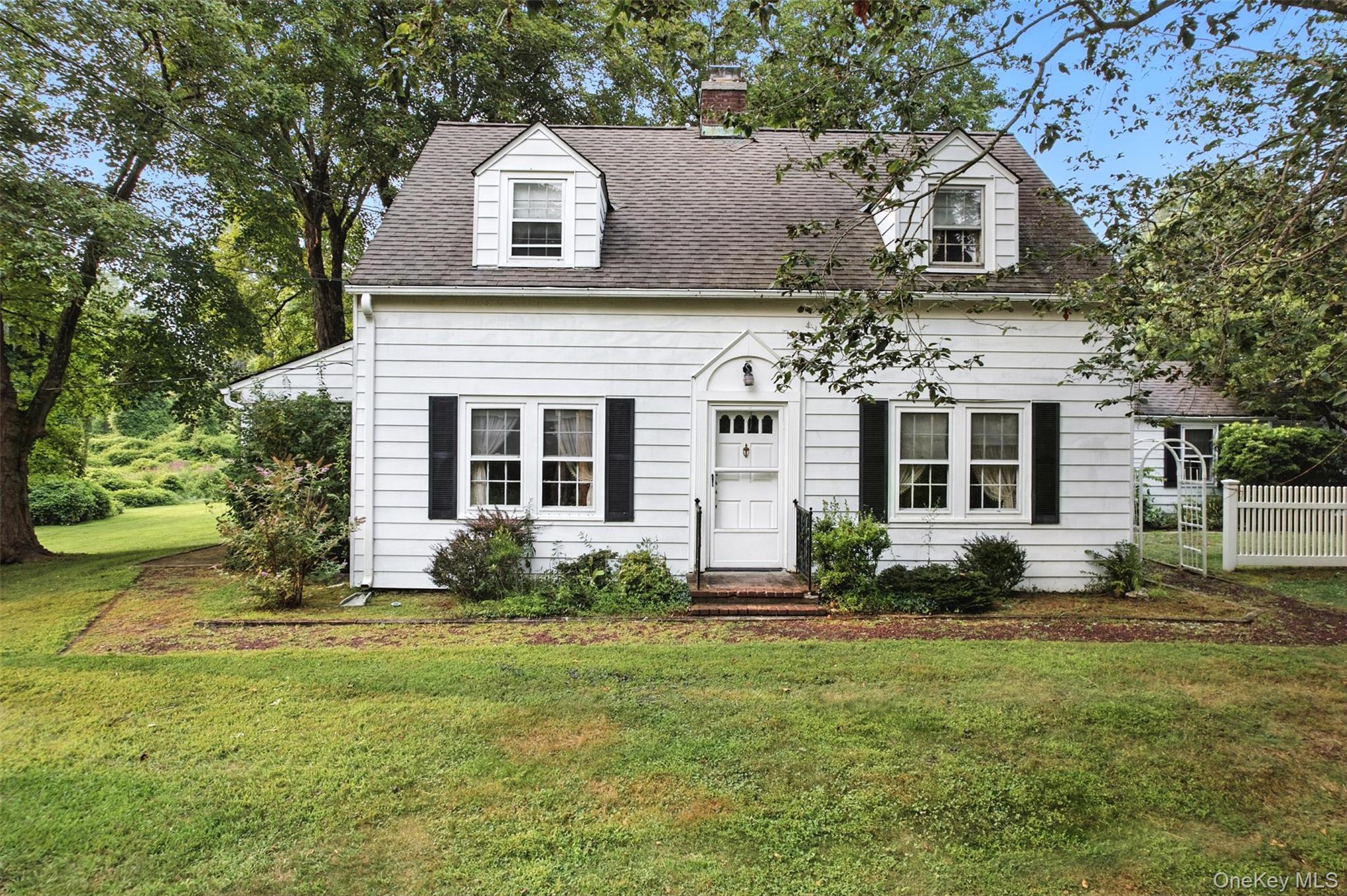 Situated on one glorious acre in Katonah, this charming 3 bedroom home, lovingly referred to as "the house by the side of the road" has been in the same family since 1960 and is now ready for its next chapter. A sweet covered porch awaits you and your guests, the perfect spot to relax and connect.  A delightful breezeway links the two car garage to the main house, adding both character and convenience. Inside, you will find a great bonus space on the first floor, perfect for an office or family room, as well as a versatile loft above the garage.  One glorious acre adding expansion options and great room to play, view the incredible Western sunsets.  With warmth, care and pride of ownership, this home offers a rare opportunity to live on the coveted Todd Road in Katonah and craft a home that reflects your vision. A beloved gem, waiting for you to make it your own.